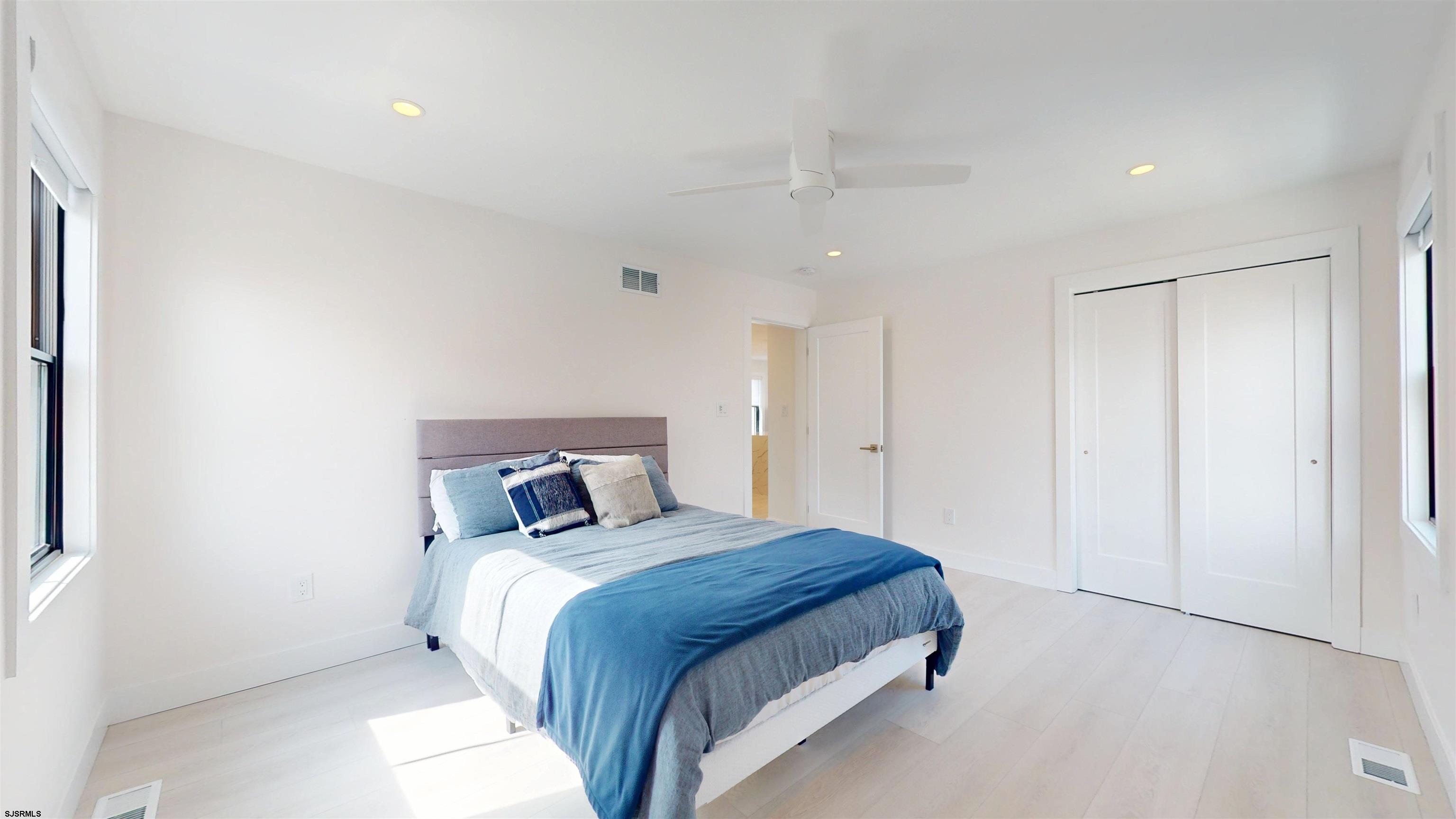 342 38th Street South Brigantine, NJ 08203 - Photo 54 of 86 a bedroom with a bed and a night stand