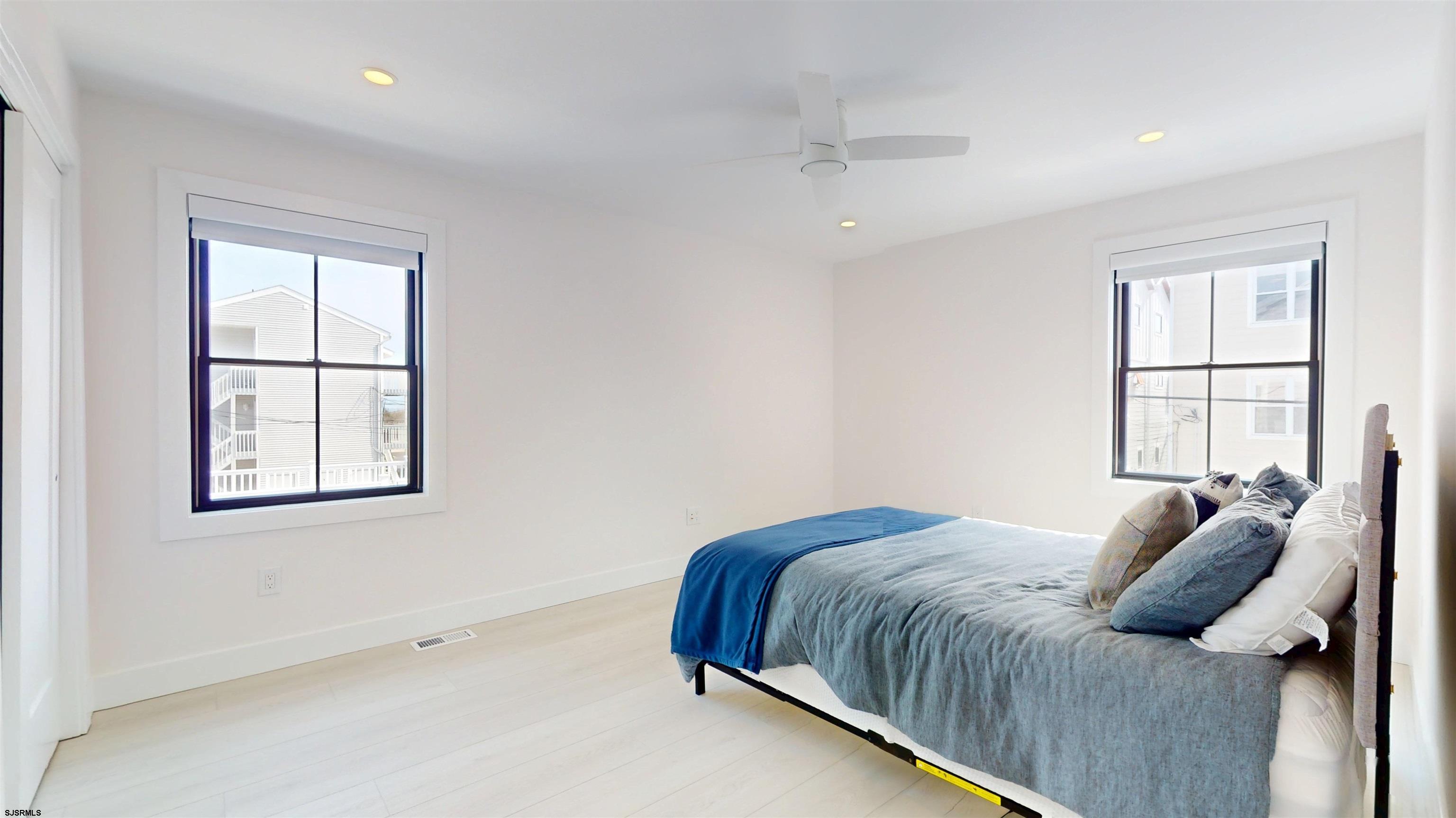 342 38th Street South Brigantine, NJ 08203 - Photo 56 of 86 a bedroom with a bed and a window