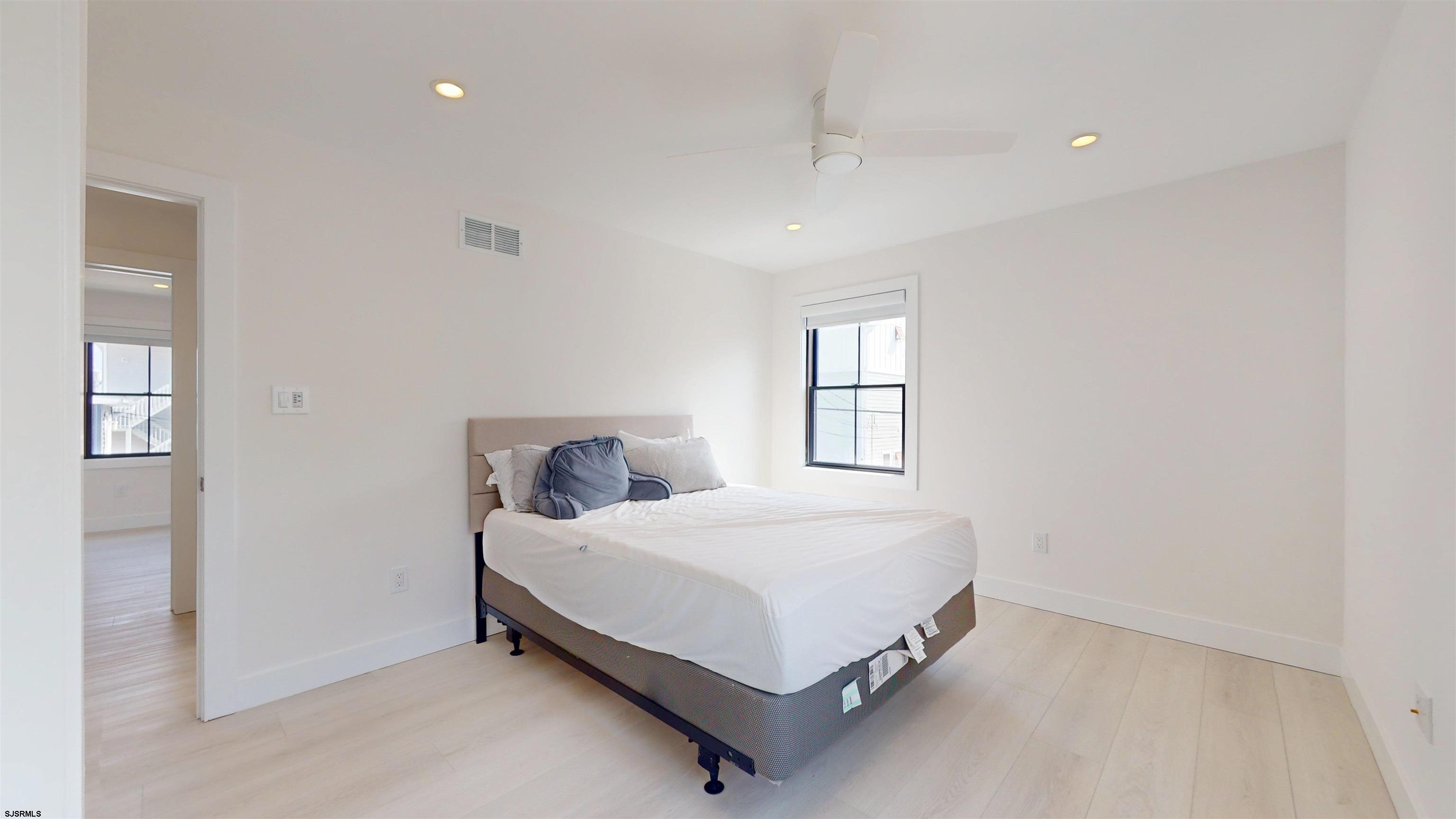 342 38th Street South Brigantine, NJ 08203 - Photo 57 of 86 a bedroom with a bed and window