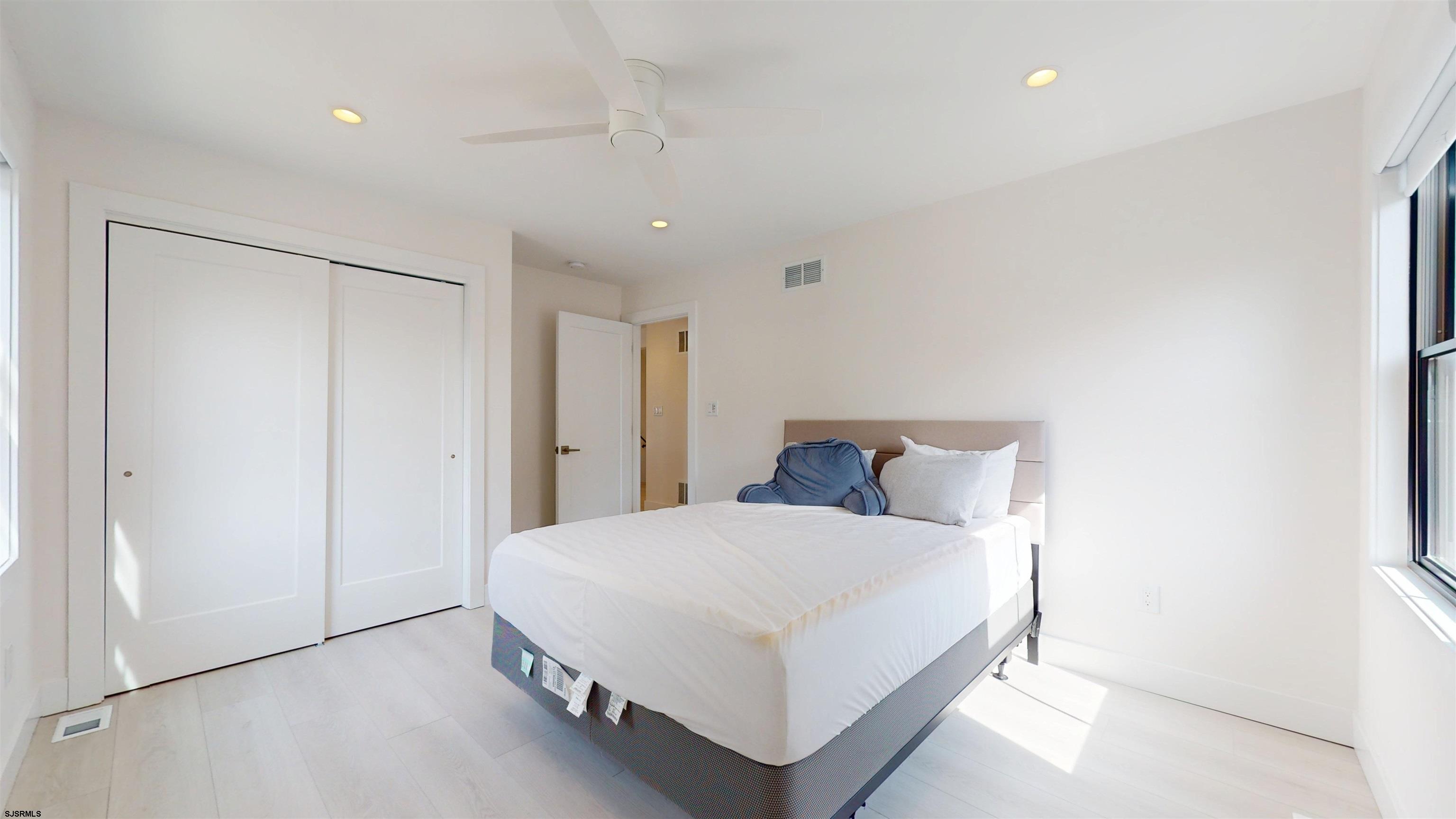 342 38th Street South Brigantine, NJ 08203 - Photo 58 of 86 a large bedroom with a bed and a closet