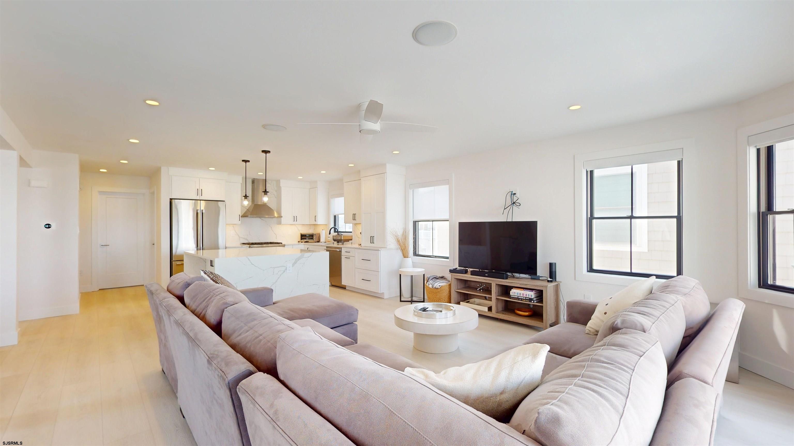 342 38th Street South Brigantine, NJ 08203 - Photo 6 of 86 a living room with furniture and a flat screen tv