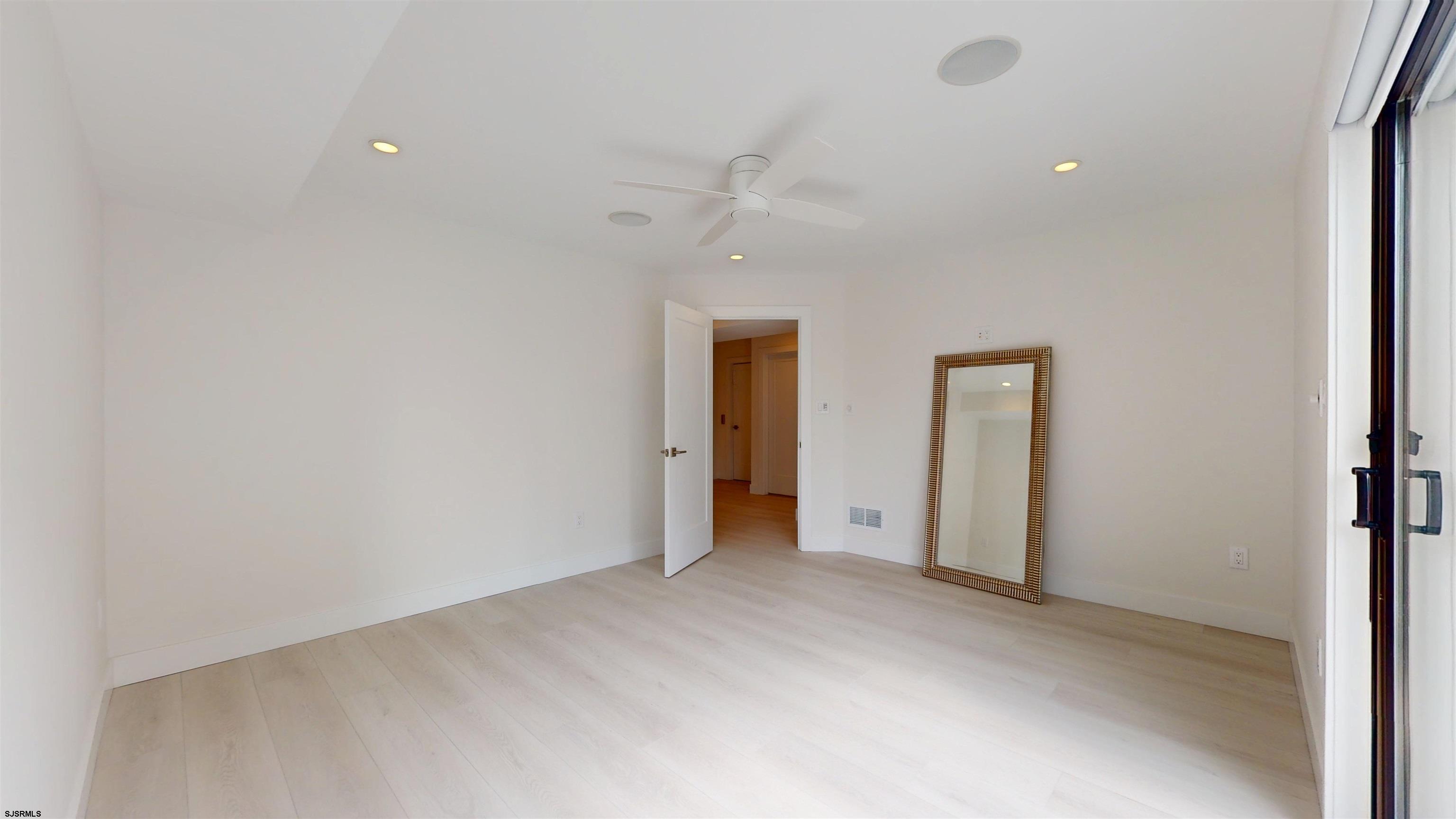 342 38th Street South Brigantine, NJ 08203 - Photo 62 of 86 an empty room with closet and a ceiling fan