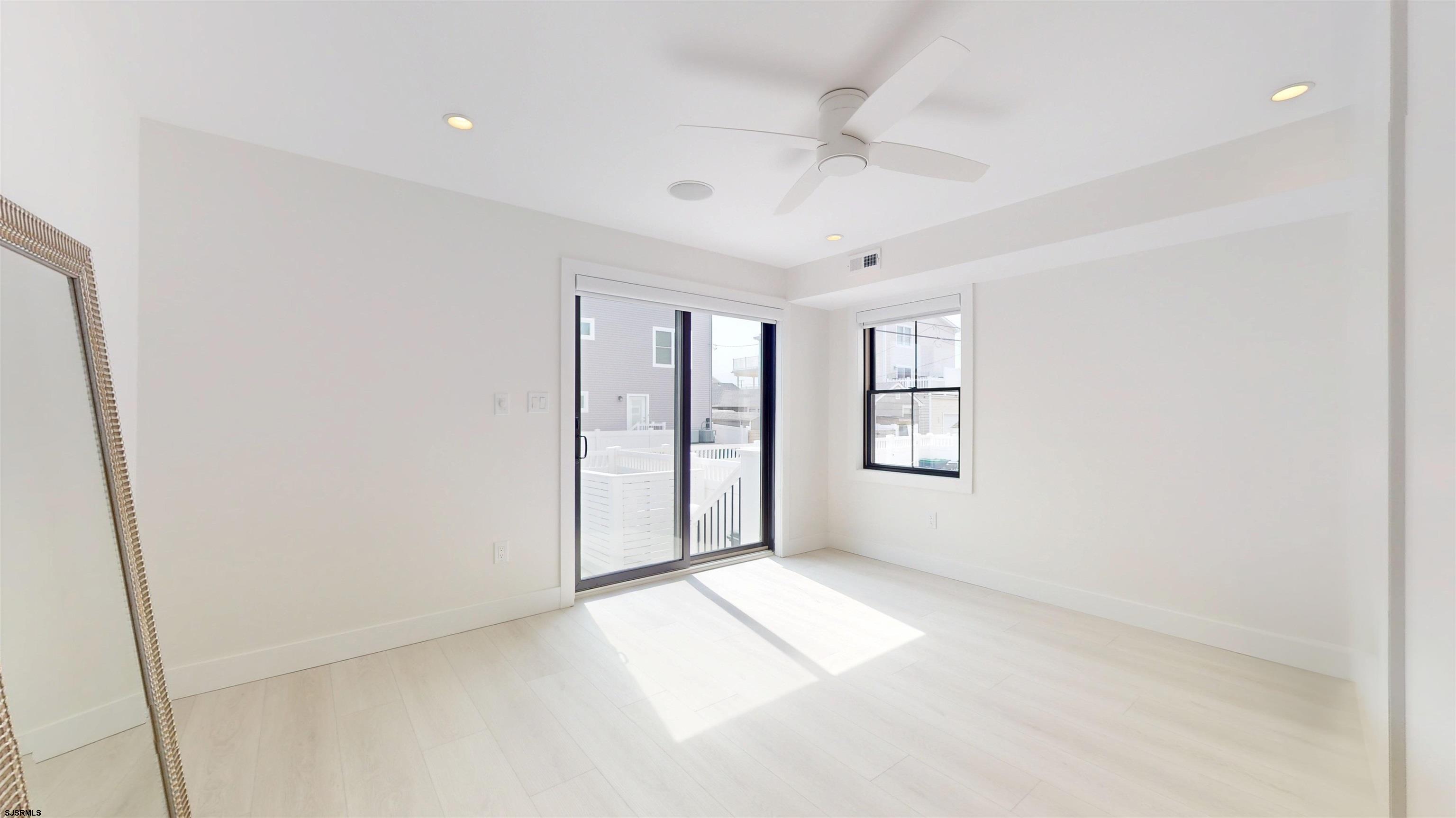 342 38th Street South Brigantine, NJ 08203 - Photo 65 of 86 a view of an empty room with a window