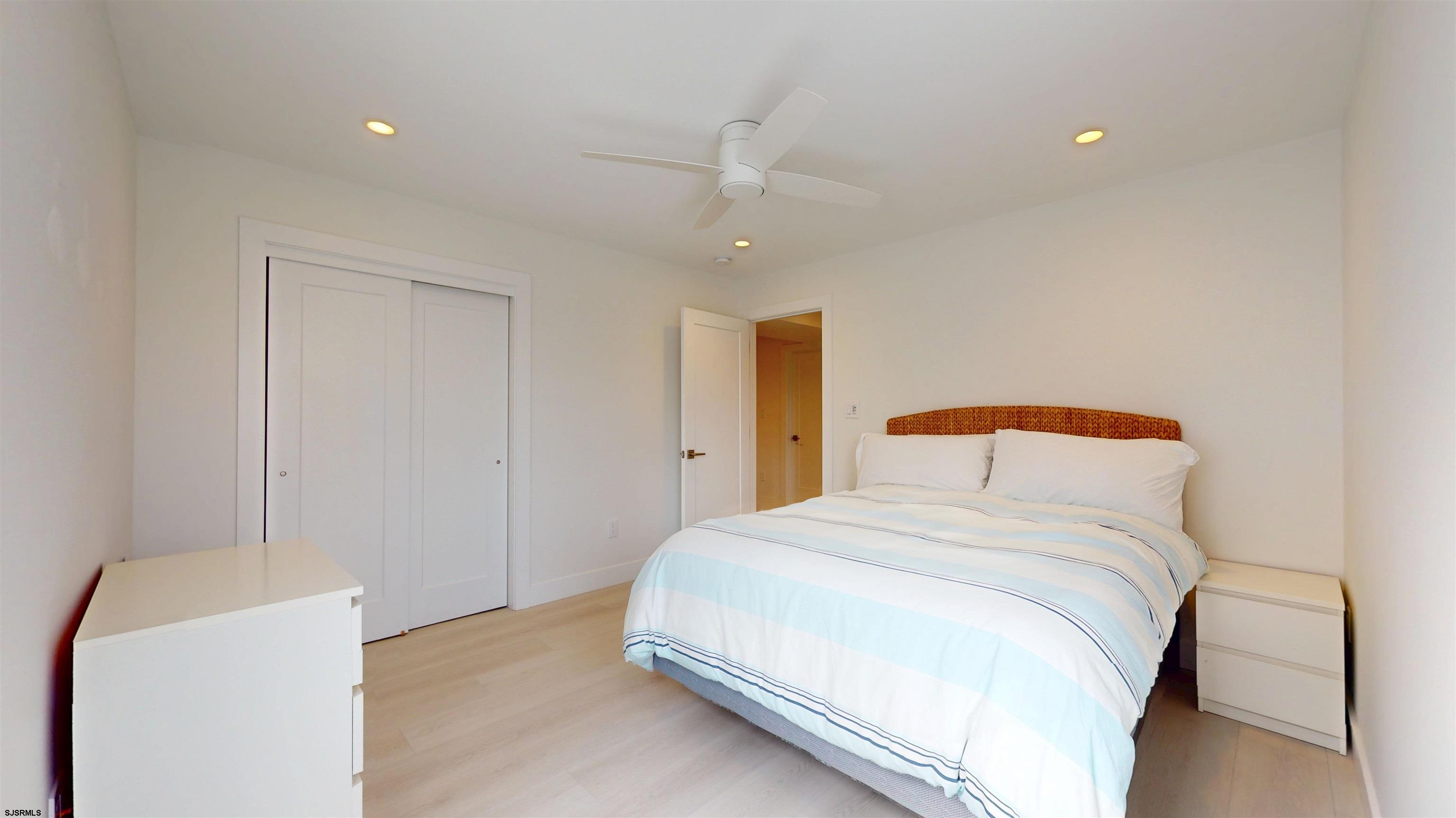 342 38th Street South Brigantine, NJ 08203 - Photo 67 of 86 a bedroom with a bed and a refrigerator