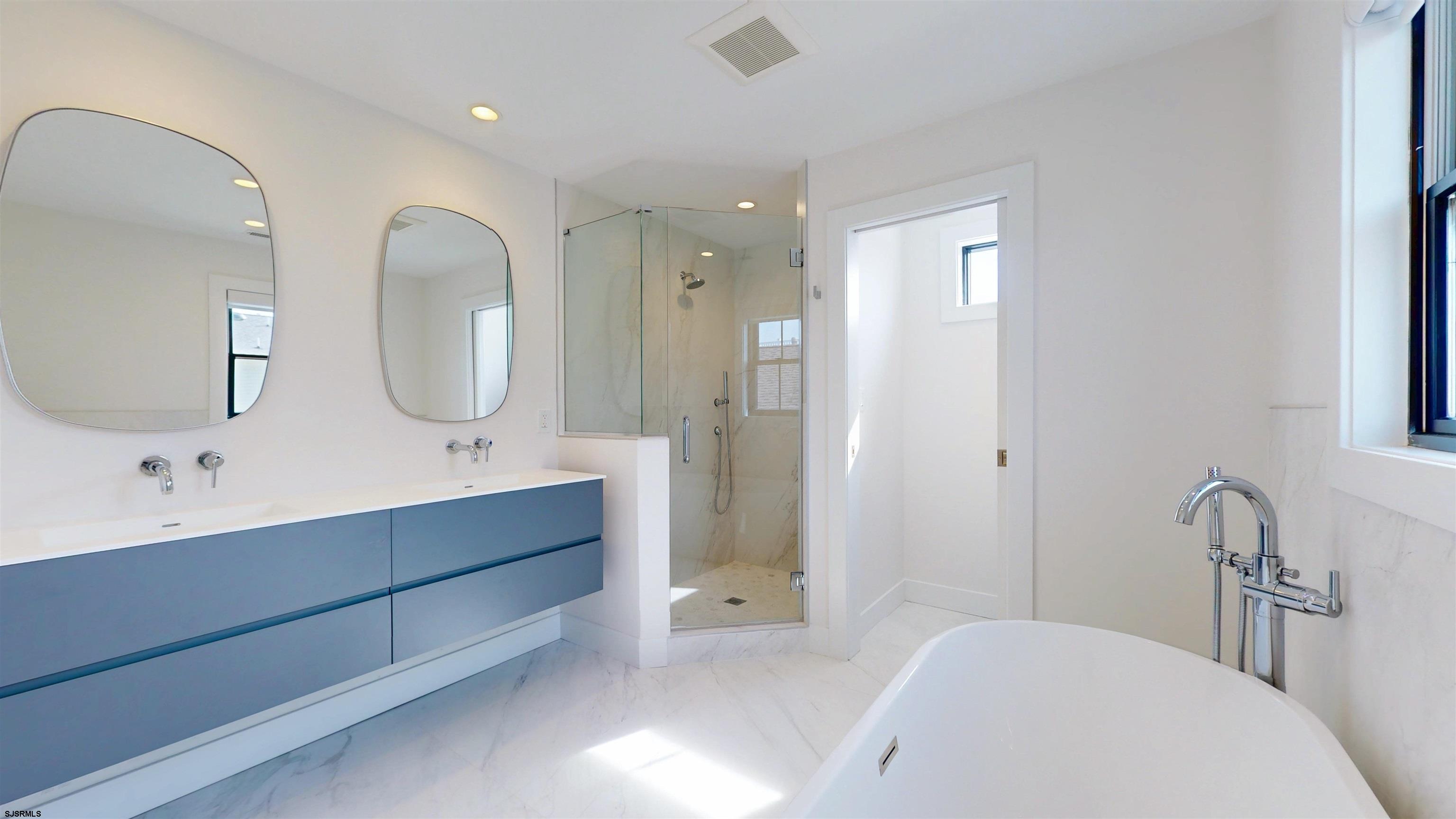 342 38th Street South Brigantine, NJ 08203 - Photo 68 of 86 a spacious bathroom with a double vanity sink and a mirror
