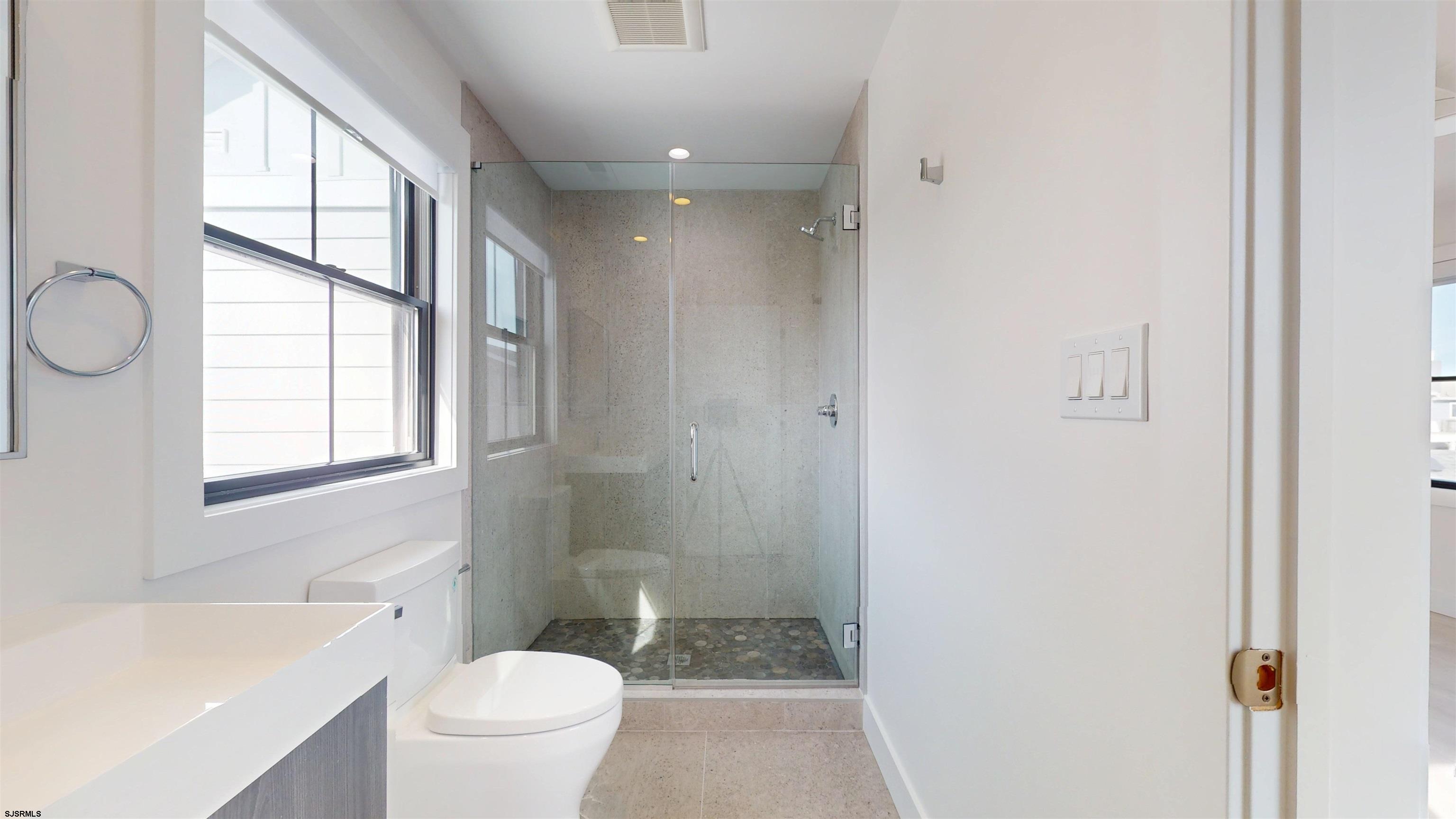 342 38th Street South Brigantine, NJ 08203 - Photo 70 of 86 a bathroom with a toilet a sink and a bathtub