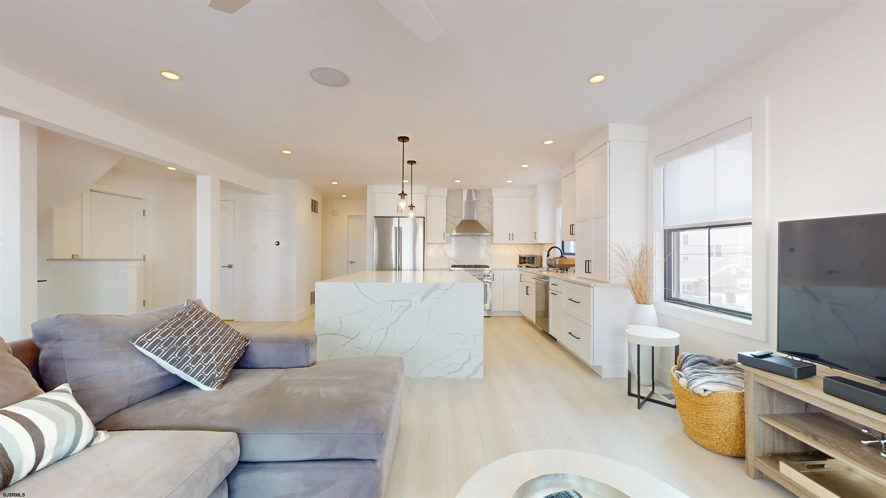 342 38th Street South Brigantine, NJ 08203 - Photo 7 of 86 a living room with furniture and a flat screen tv