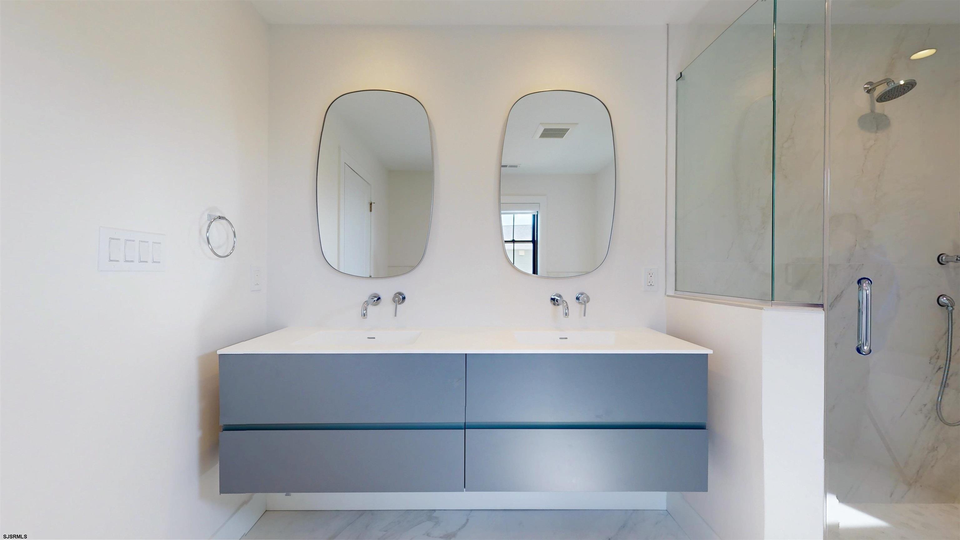 342 38th Street South Brigantine, NJ 08203 - Photo 74 of 86 a bathroom with a sink and a mirror