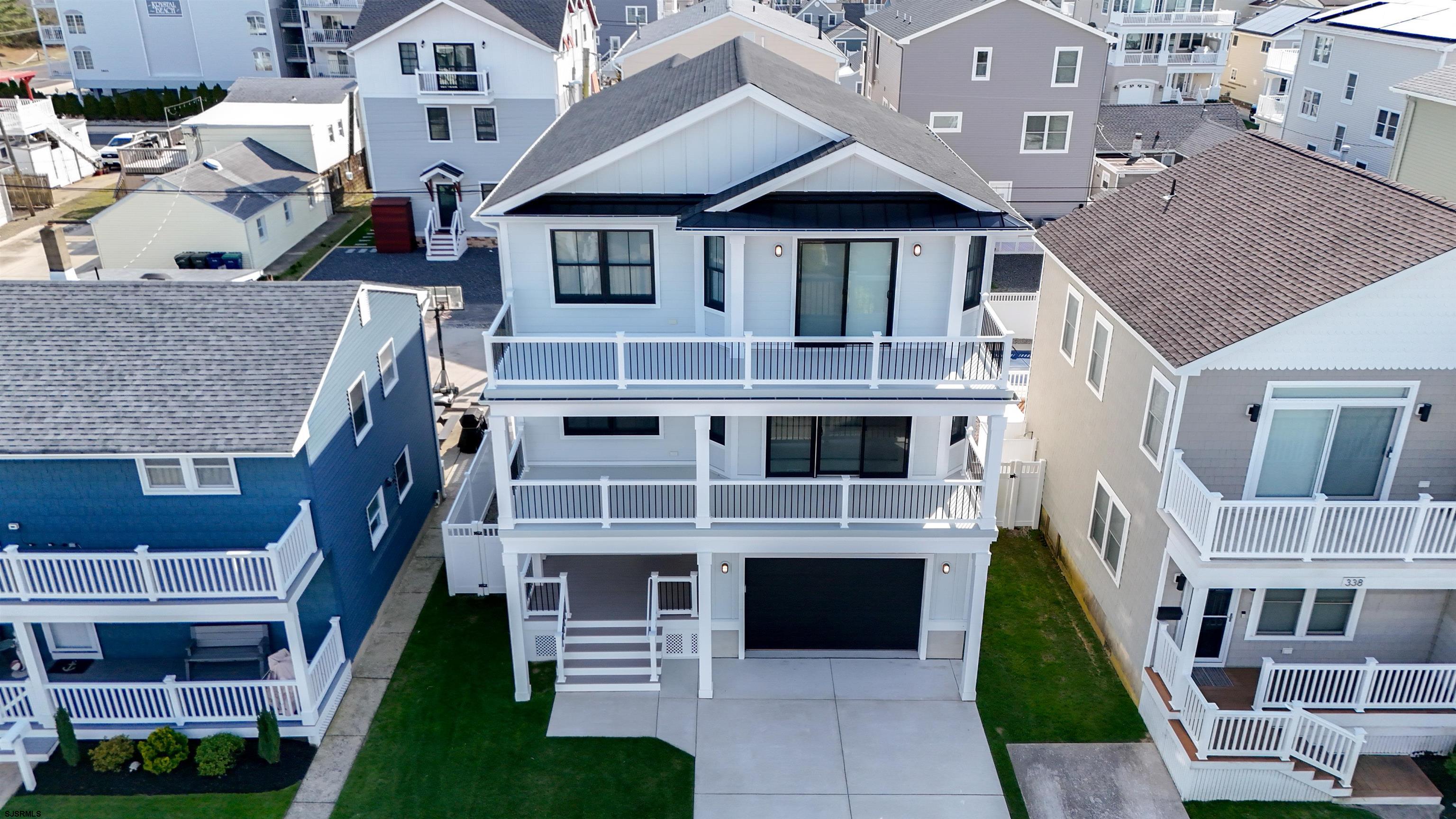 342 38th Street South Brigantine, NJ 08203 - Photo 80 of 86 a front view of a house with a yard