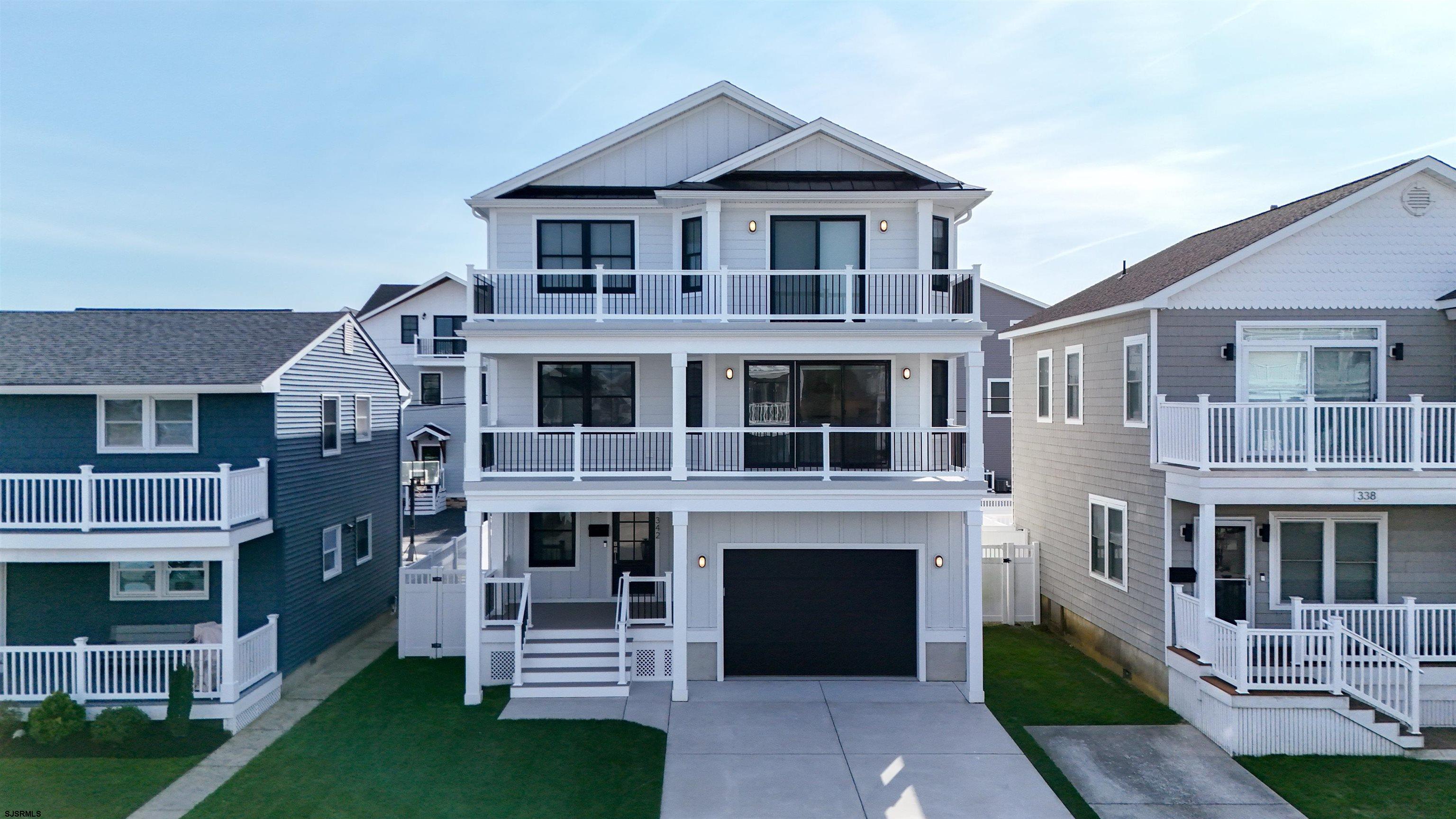 342 38th Street South Brigantine, NJ 08203 - Photo 82 of 86 a front view of a house with a yard