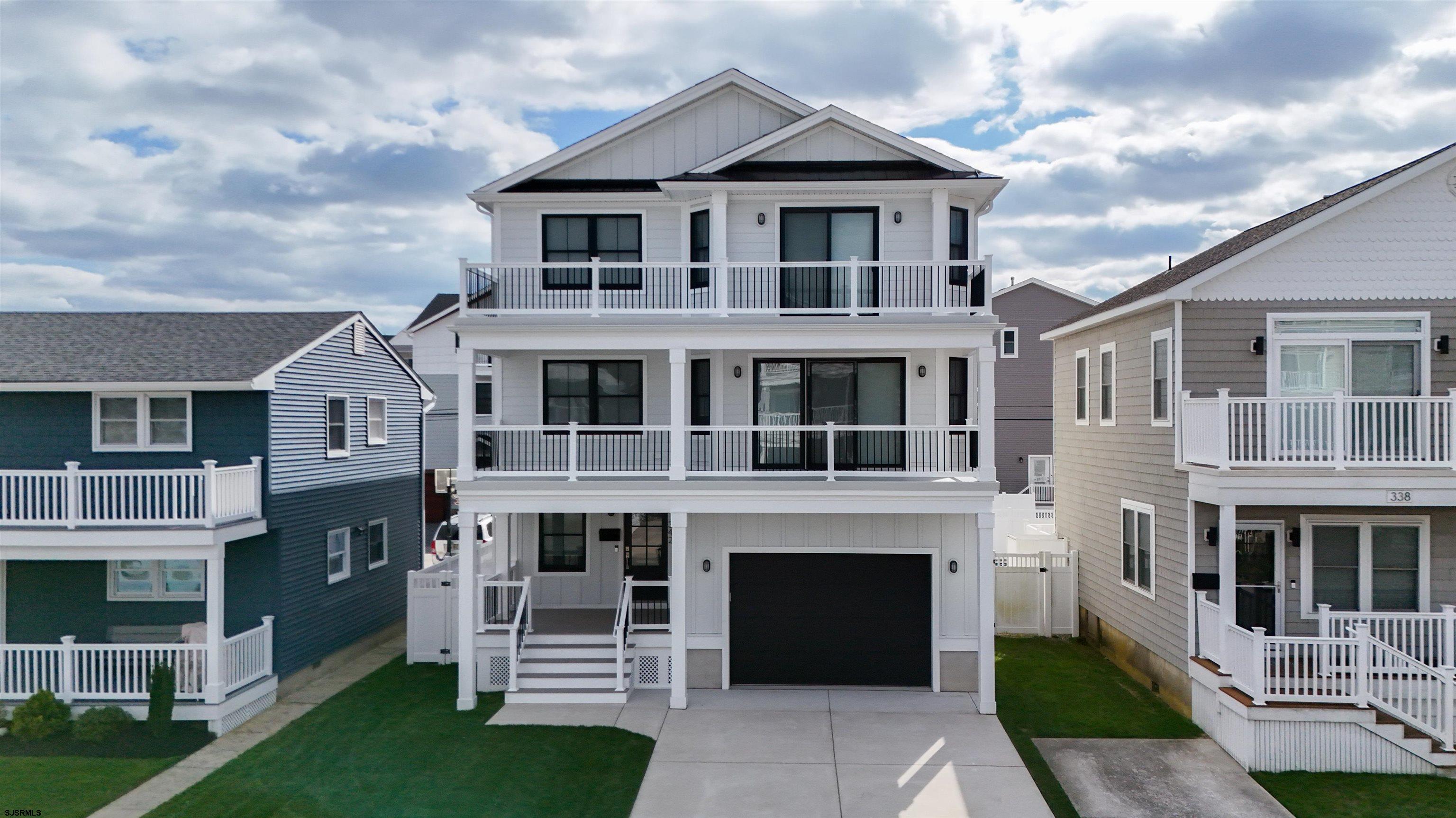 342 38th Street South Brigantine, NJ 08203 - Photo 84 of 86 a front view of a house with a yard
