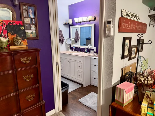a view of living room with furniture and wooden floor