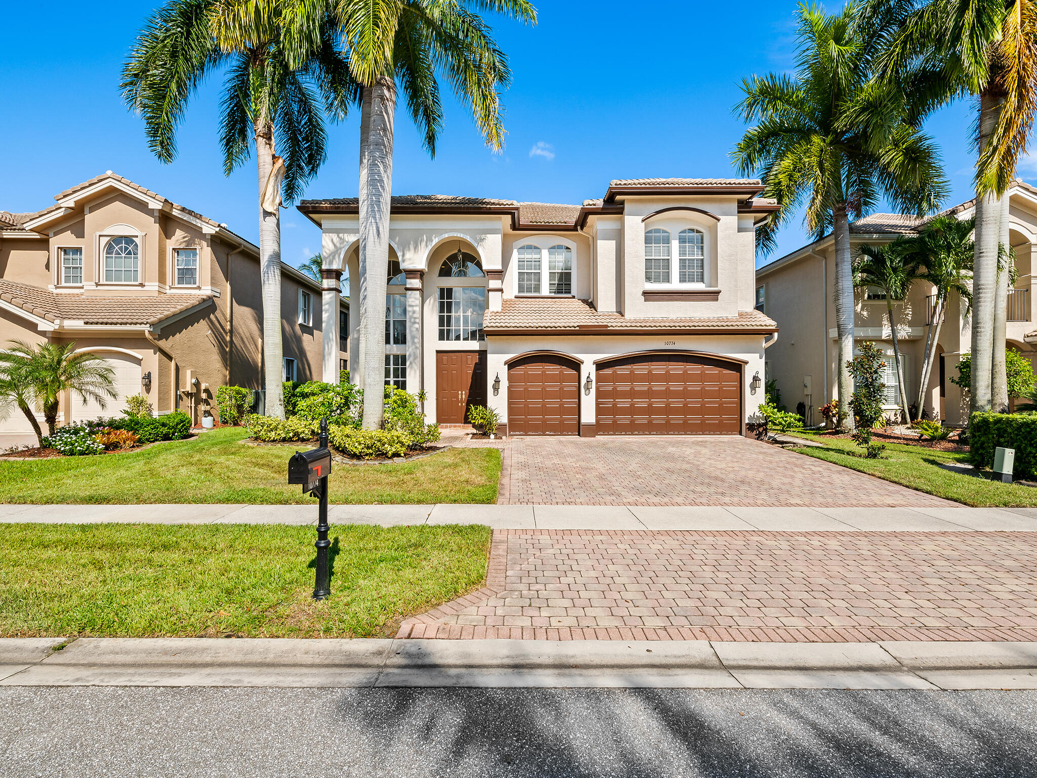 10774 Sunset Ridge Circle Boynton Beach, FL 33473 - Photo 1 of 39 front view of house with a yard