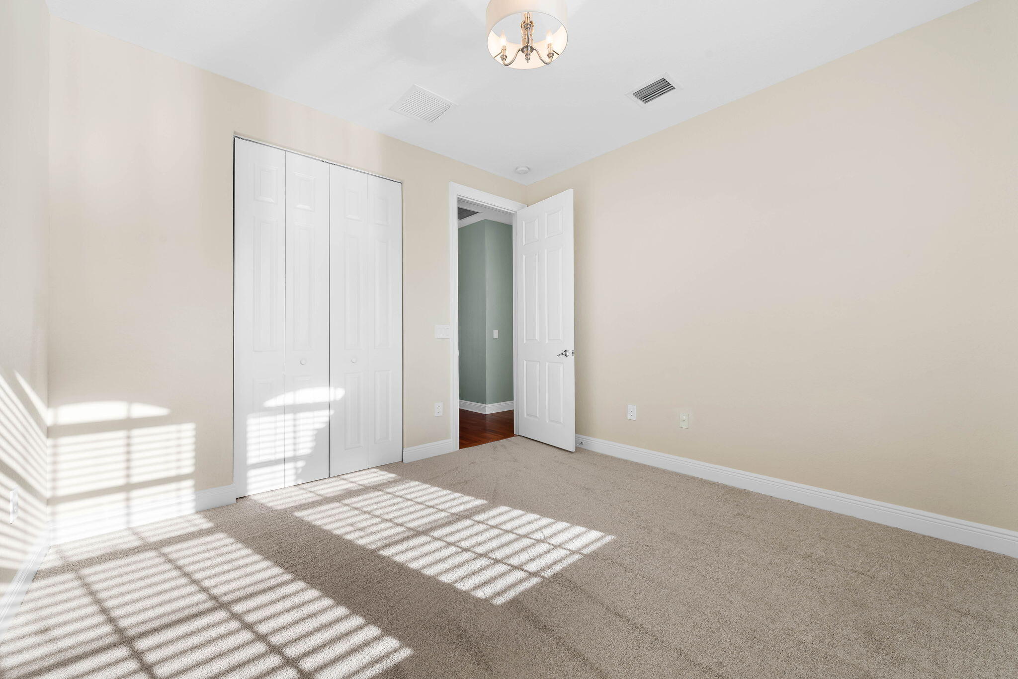 10774 Sunset Ridge Circle Boynton Beach, FL 33473 - Photo 27 of 39 a bedroom with a bed and a window