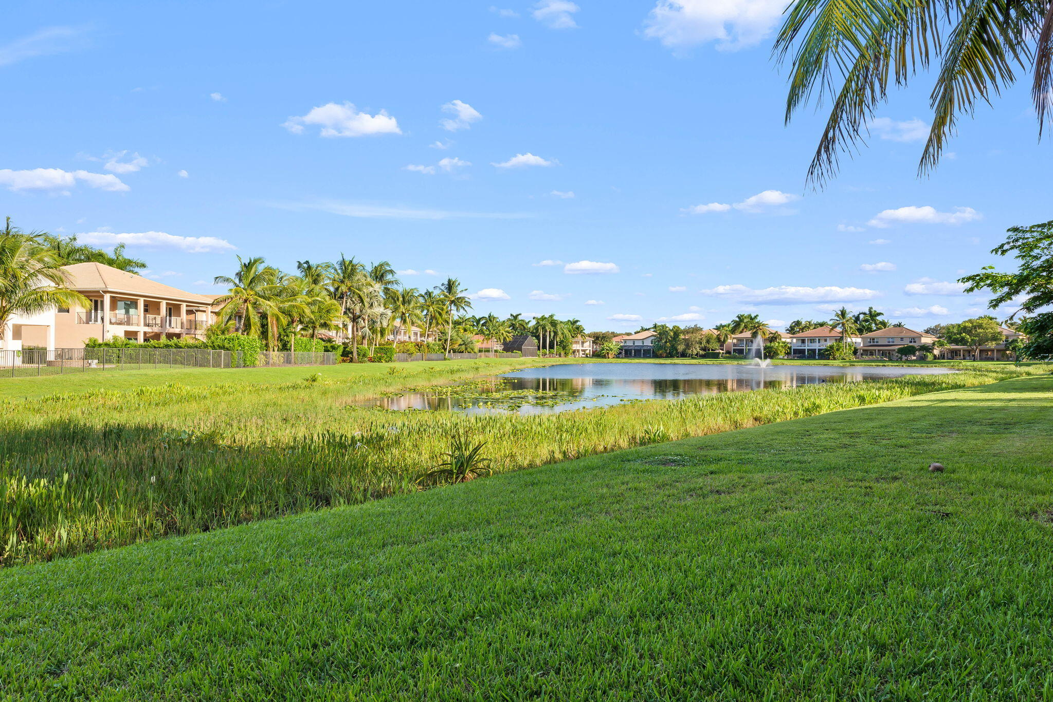 10774 Sunset Ridge Circle Boynton Beach, FL 33473 - Photo 37 of 39 a view of a lake with houses in the back