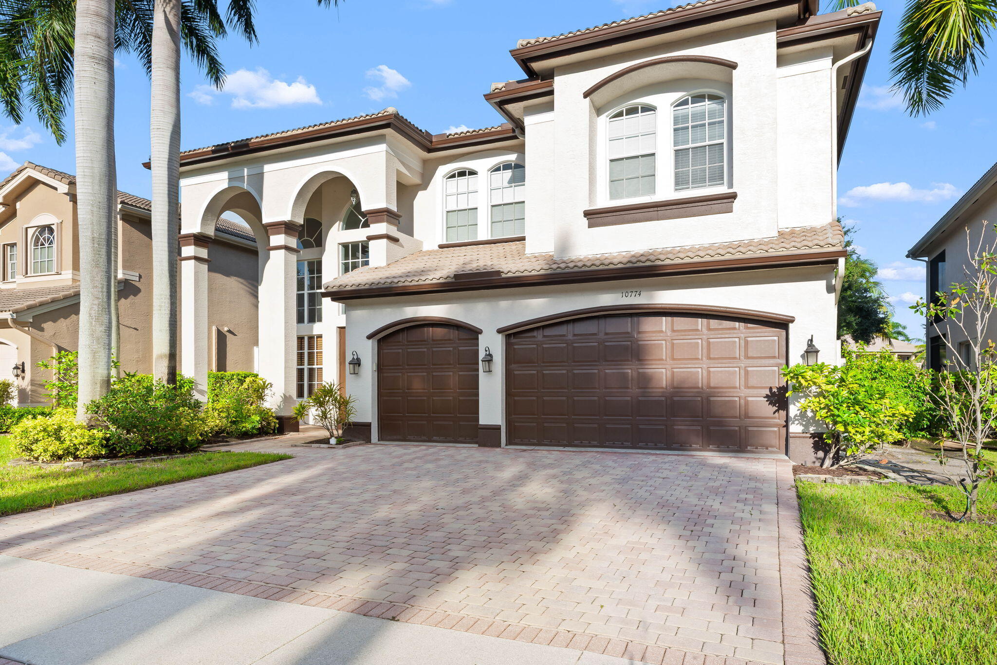10774 Sunset Ridge Circle Boynton Beach, FL 33473 - Photo 39 of 39 a front view of a house with garden