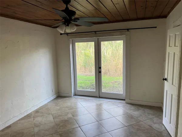 a view of an empty room with a sliding door