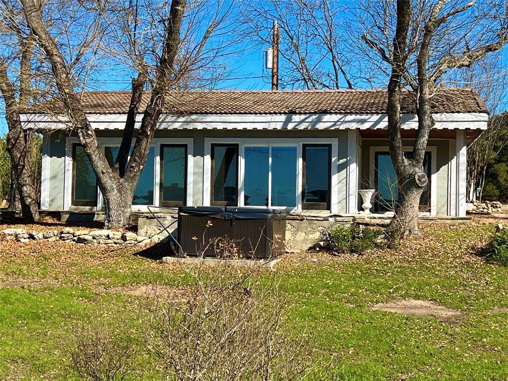 17313 West Beach Road Austin, TX 78734 - Photo 19 of 31 front view of a house with a large tree