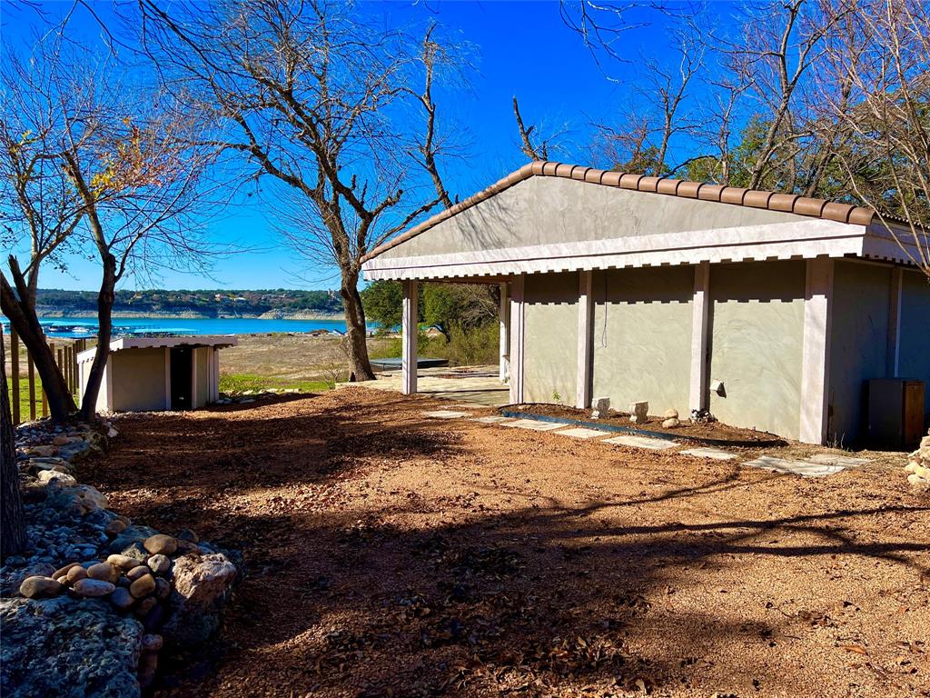 17313 West Beach Road Austin, TX 78734 - Photo 2 of 31 a backyard of a house with a shaded area