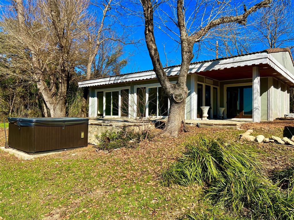 17313 West Beach Road Austin, TX 78734 - Photo 25 of 31 front view of a house with a yard