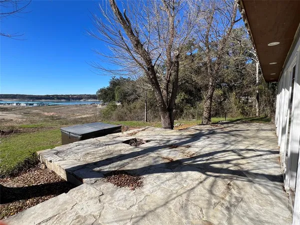 a view of a roof deck with a lake view