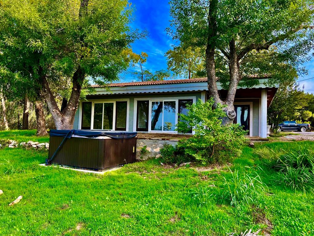 17313 West Beach Road Austin, TX 78734 - Photo 4 of 31 a view of house with a yard