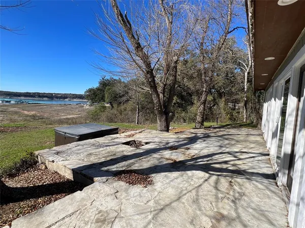 a view of a backyard with wooden floor