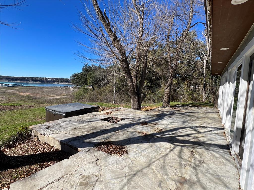17313 West Beach Road Austin, TX 78734 - Photo 9 of 31 a view of a backyard with wooden floor