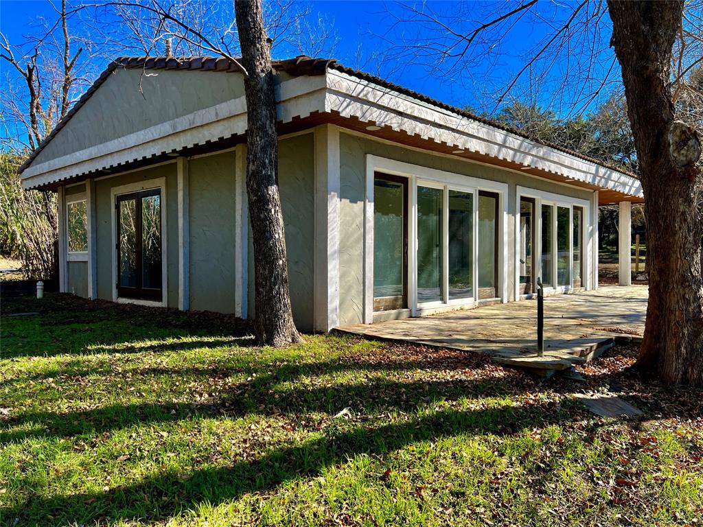 17313 West Beach Road Austin, TX 78734 - Photo 10 of 31 a view of a house with yard and porch