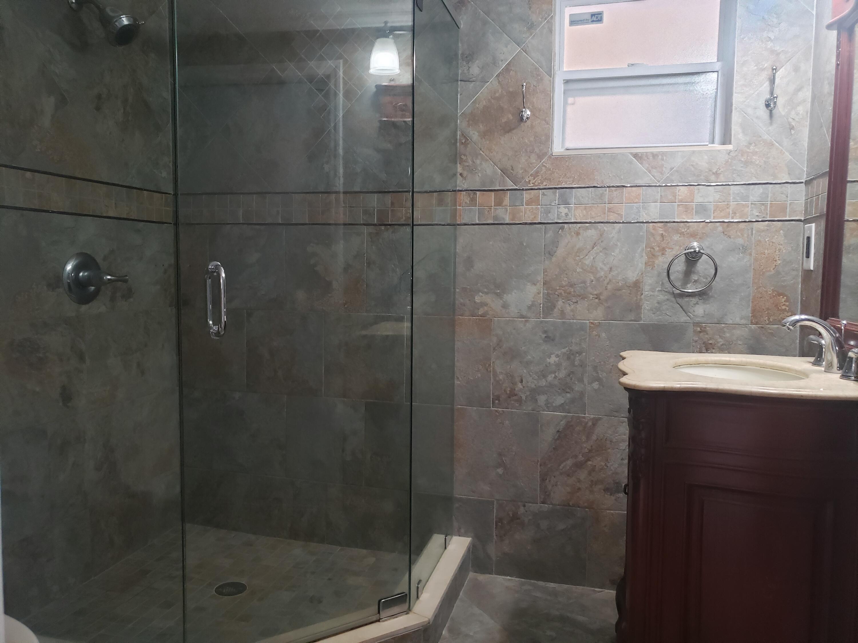7260 Grapeview Boulevard Loxahatchee, FL 33470 - Photo 18 of 36 Bathroom 2 Vanity/Shower