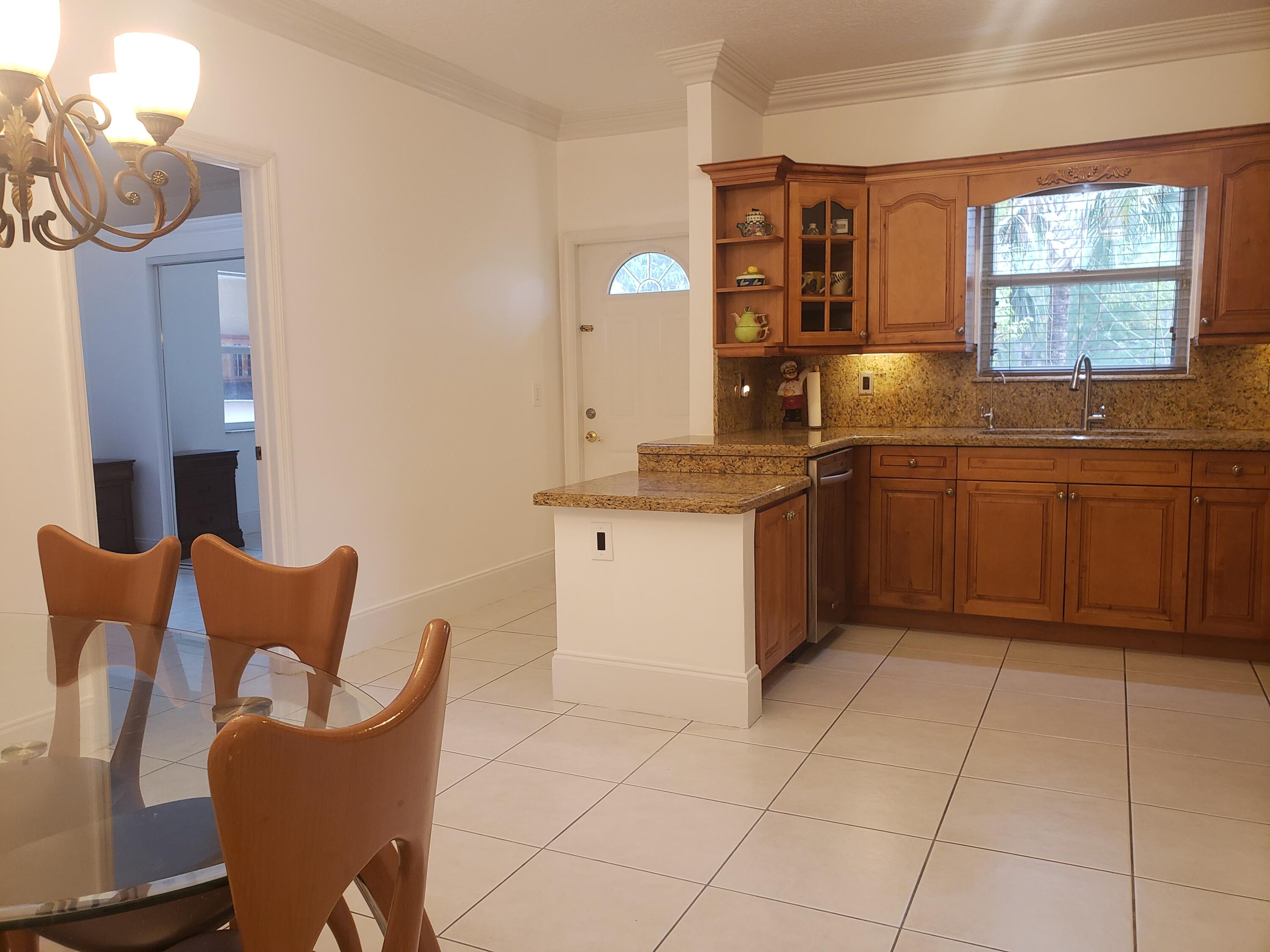 7260 Grapeview Boulevard Loxahatchee, FL 33470 - Photo 2 of 36 Dining/Kitchen Front Door