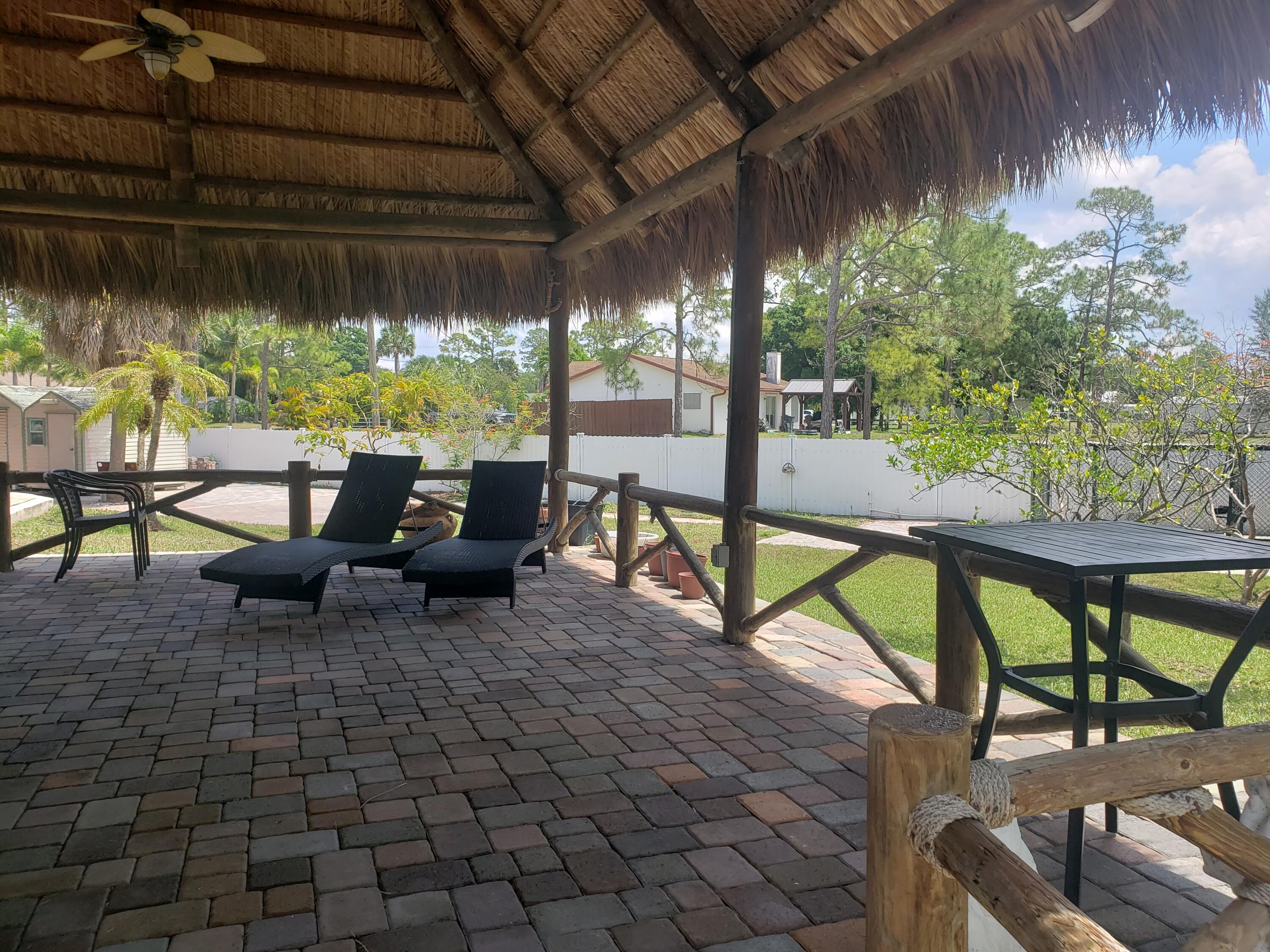 7260 Grapeview Boulevard Loxahatchee, FL 33470 - Photo 25 of 36 Tiki Hut Lounge area