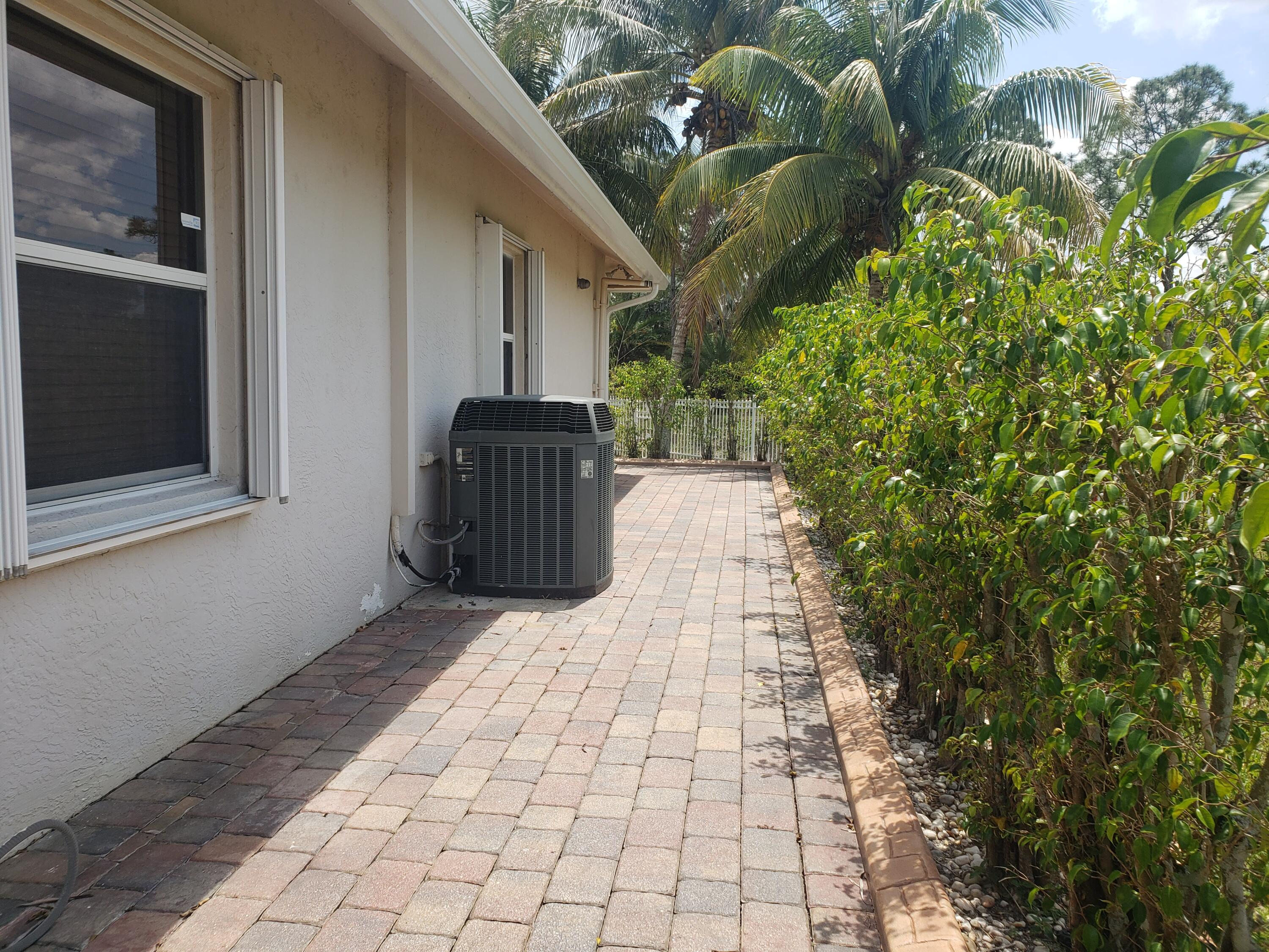 7260 Grapeview Boulevard Loxahatchee, FL 33470 - Photo 29 of 36 Walkway to Door