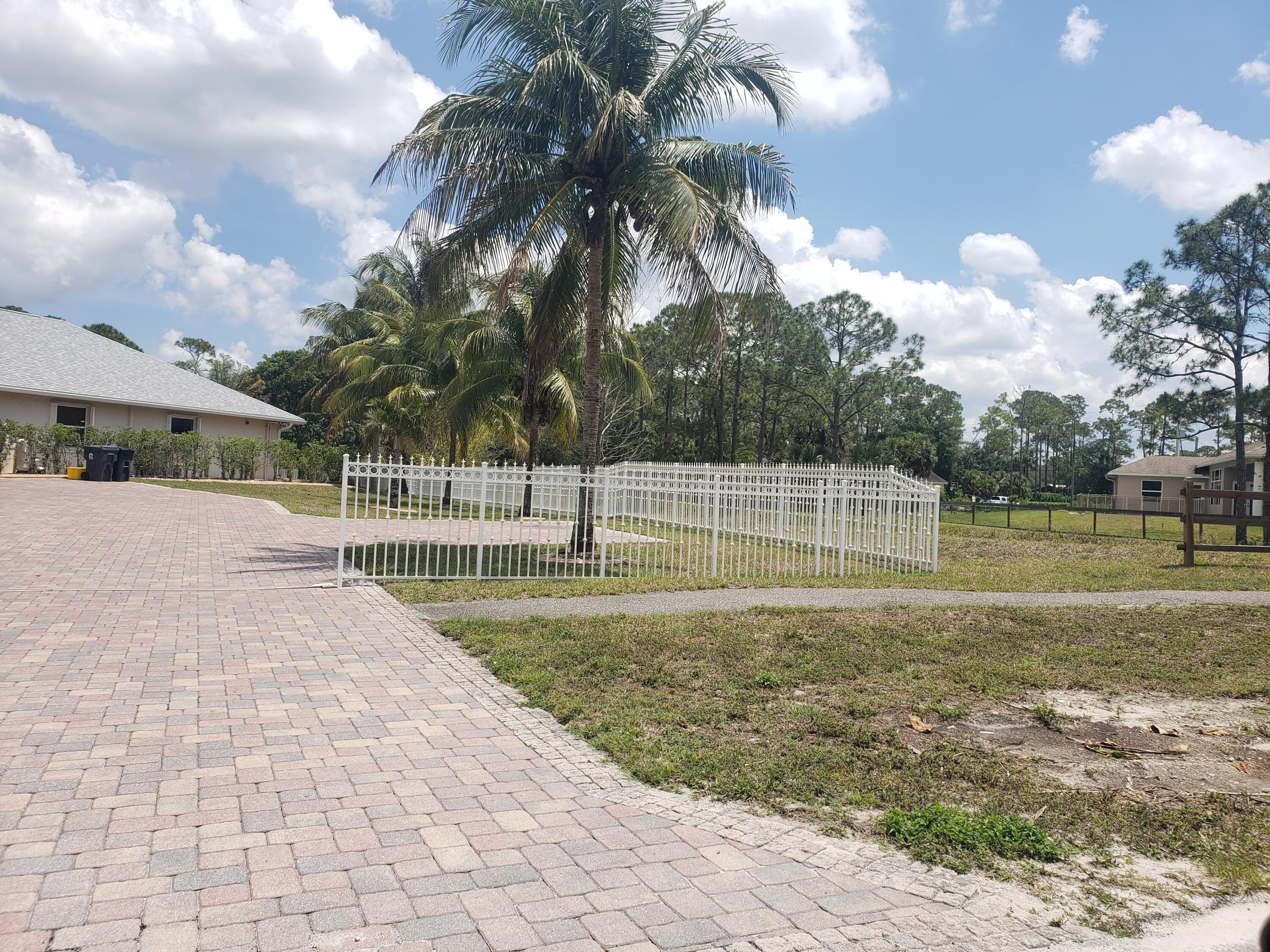 7260 Grapeview Boulevard Loxahatchee, FL 33470 - Photo 34 of 36 Long Driveway