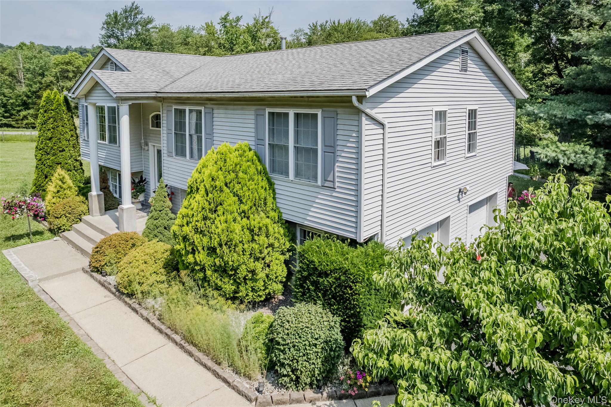 300 Mountain Lodge Road Monroe, NY 10950 - Photo 2 of 41 View of front of house featuring a shingled roof and view of scattered trees