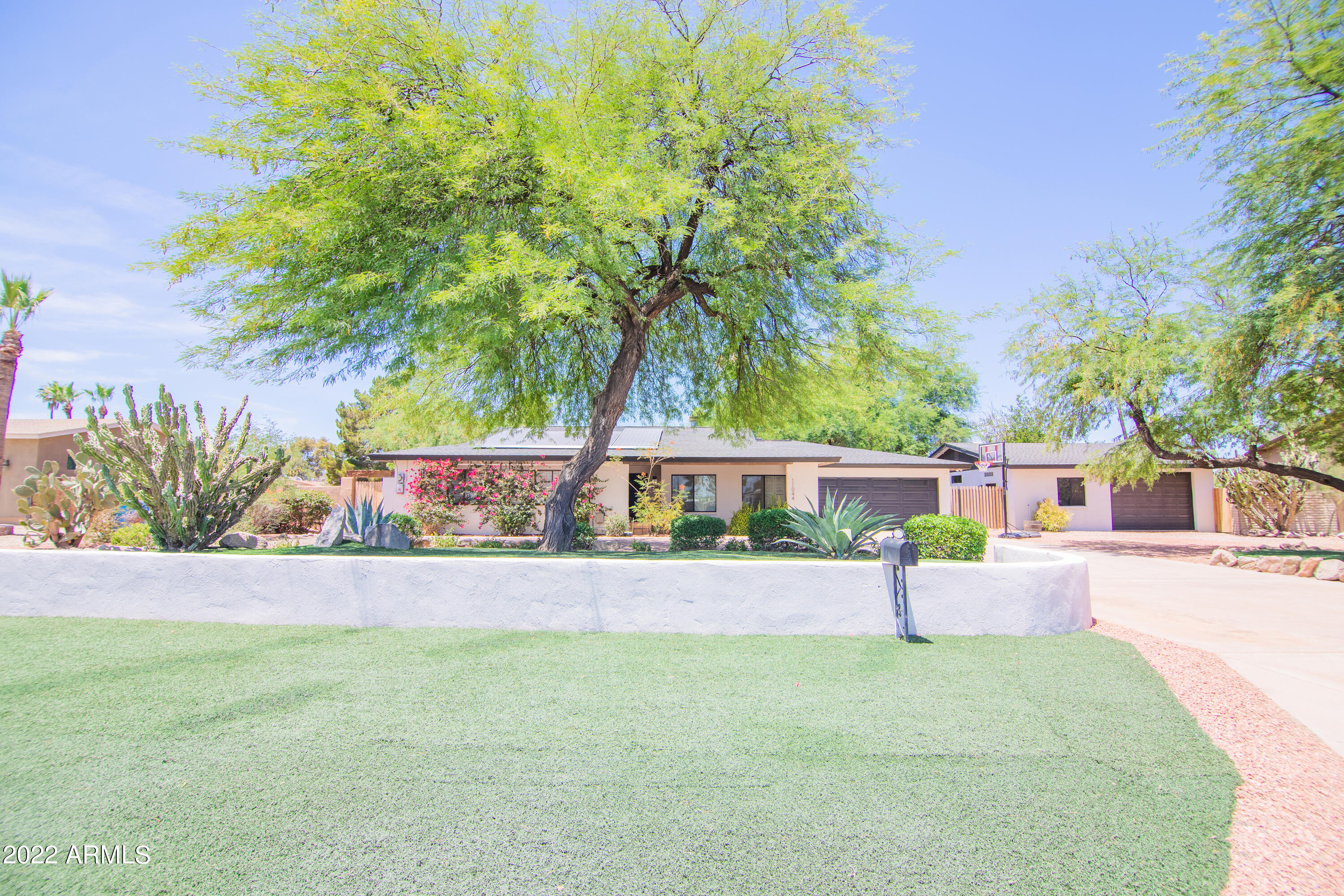 front view of a house with a yard