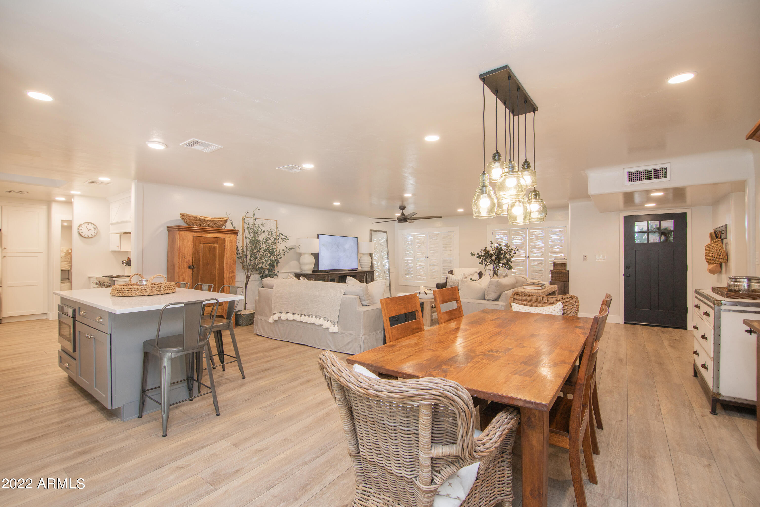 11044 North 36th Street Phoenix, AZ 85028 - Photo 13 of 49 a view of a dining room with furniture and wooden floor