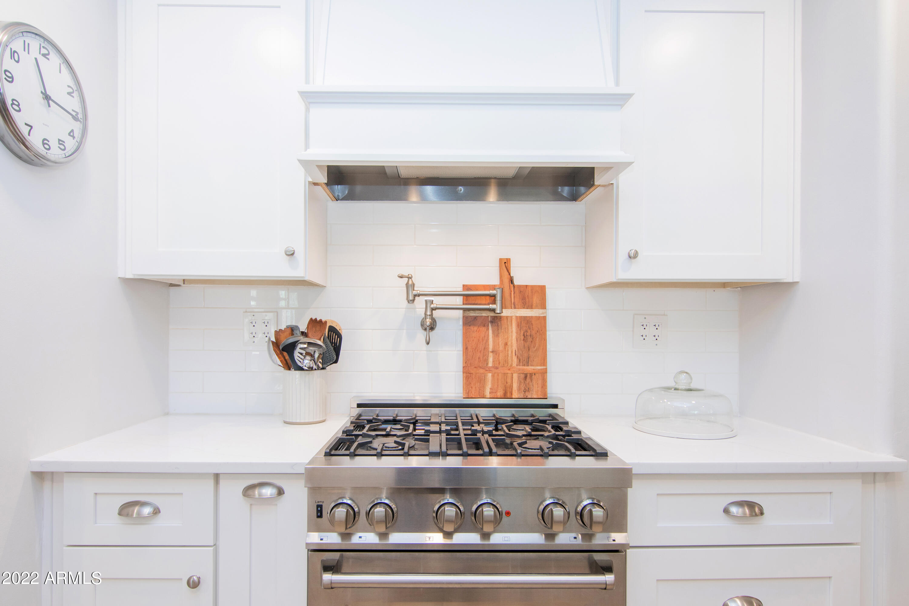 11044 North 36th Street Phoenix, AZ 85028 - Photo 19 of 49 a stove top oven sitting inside of a kitchen