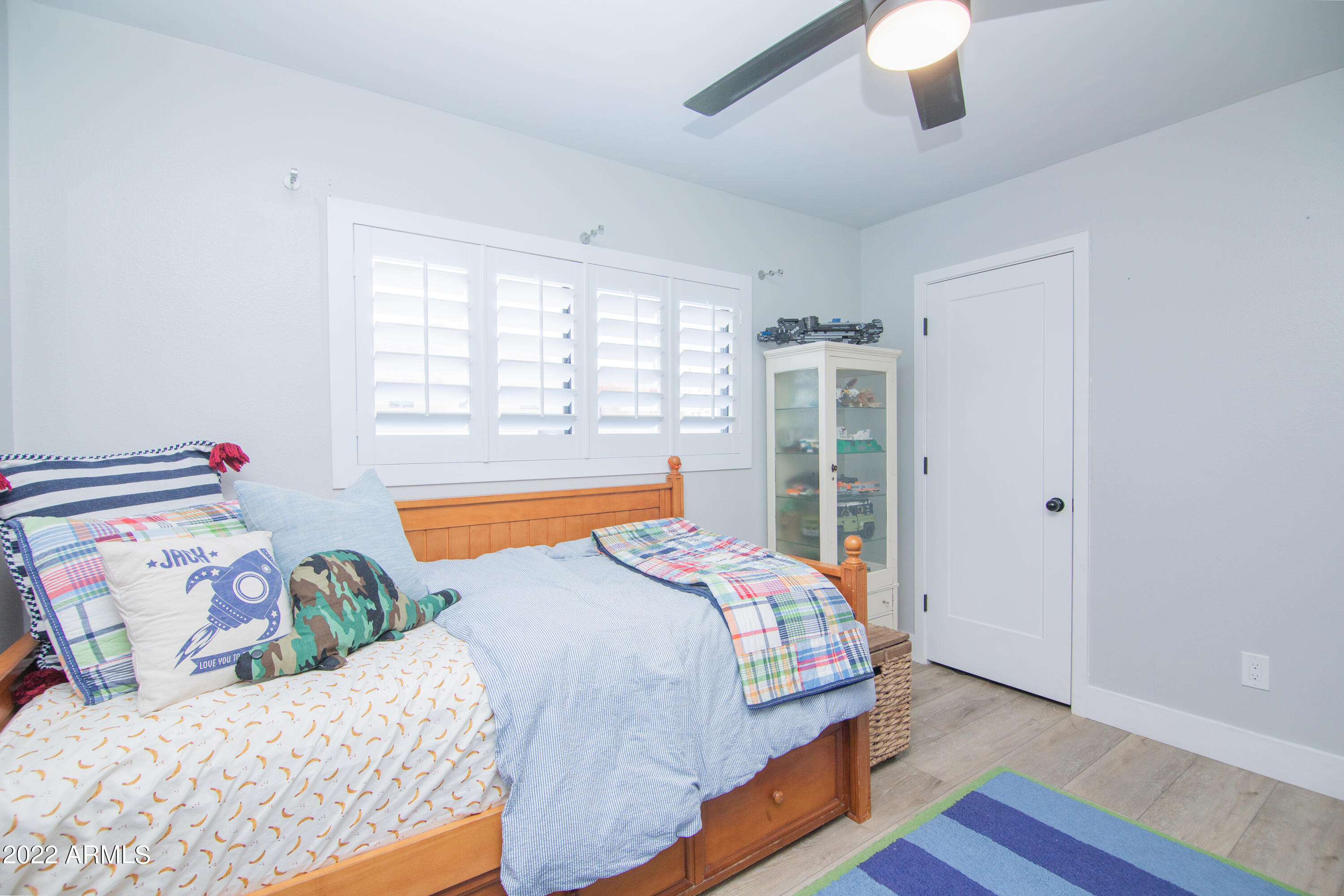 11044 North 36th Street Phoenix, AZ 85028 - Photo 30 of 49 a bedroom with two beds and a window