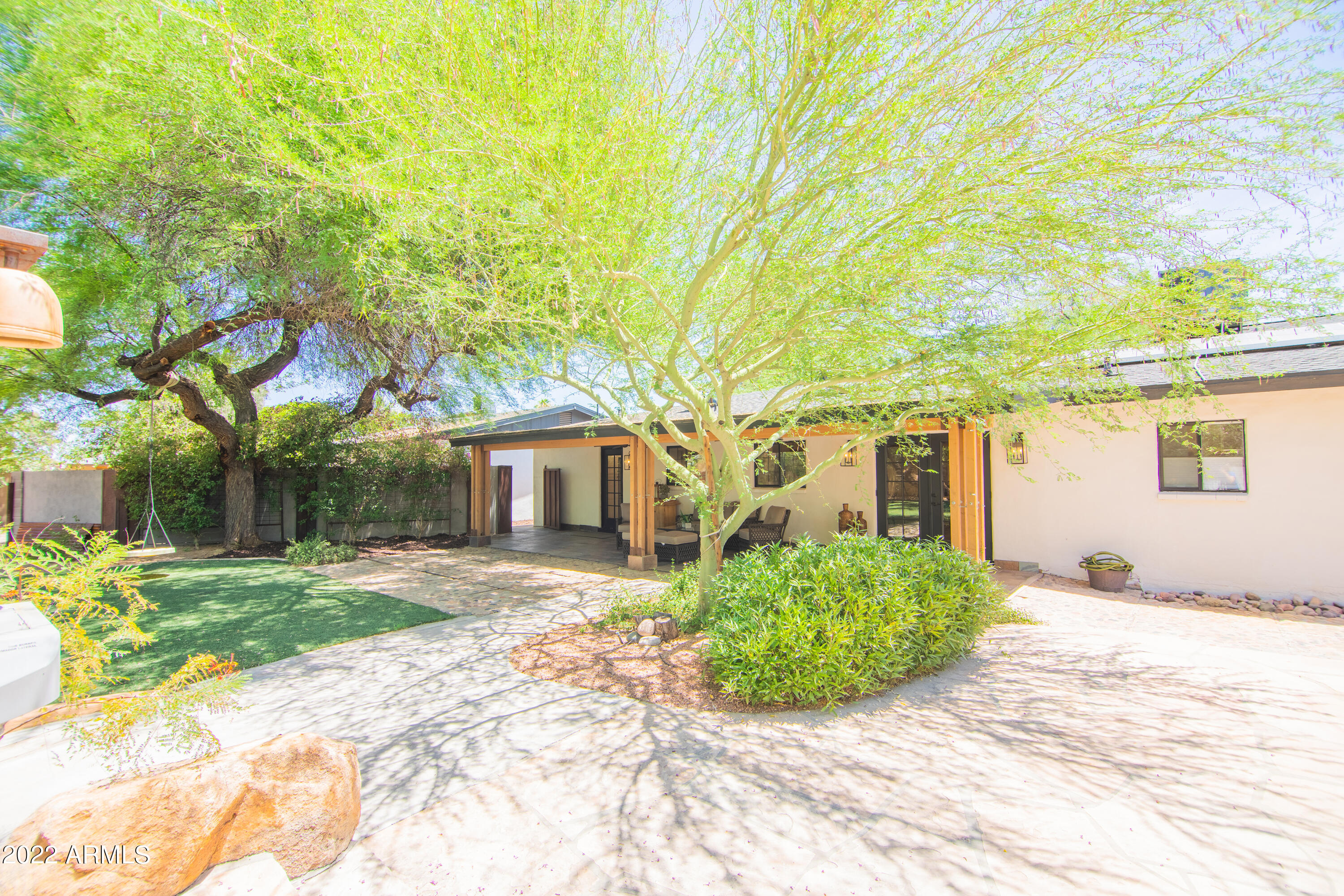11044 North 36th Street Phoenix, AZ 85028 - Photo 39 of 49 a front view of a house with a yard and garage