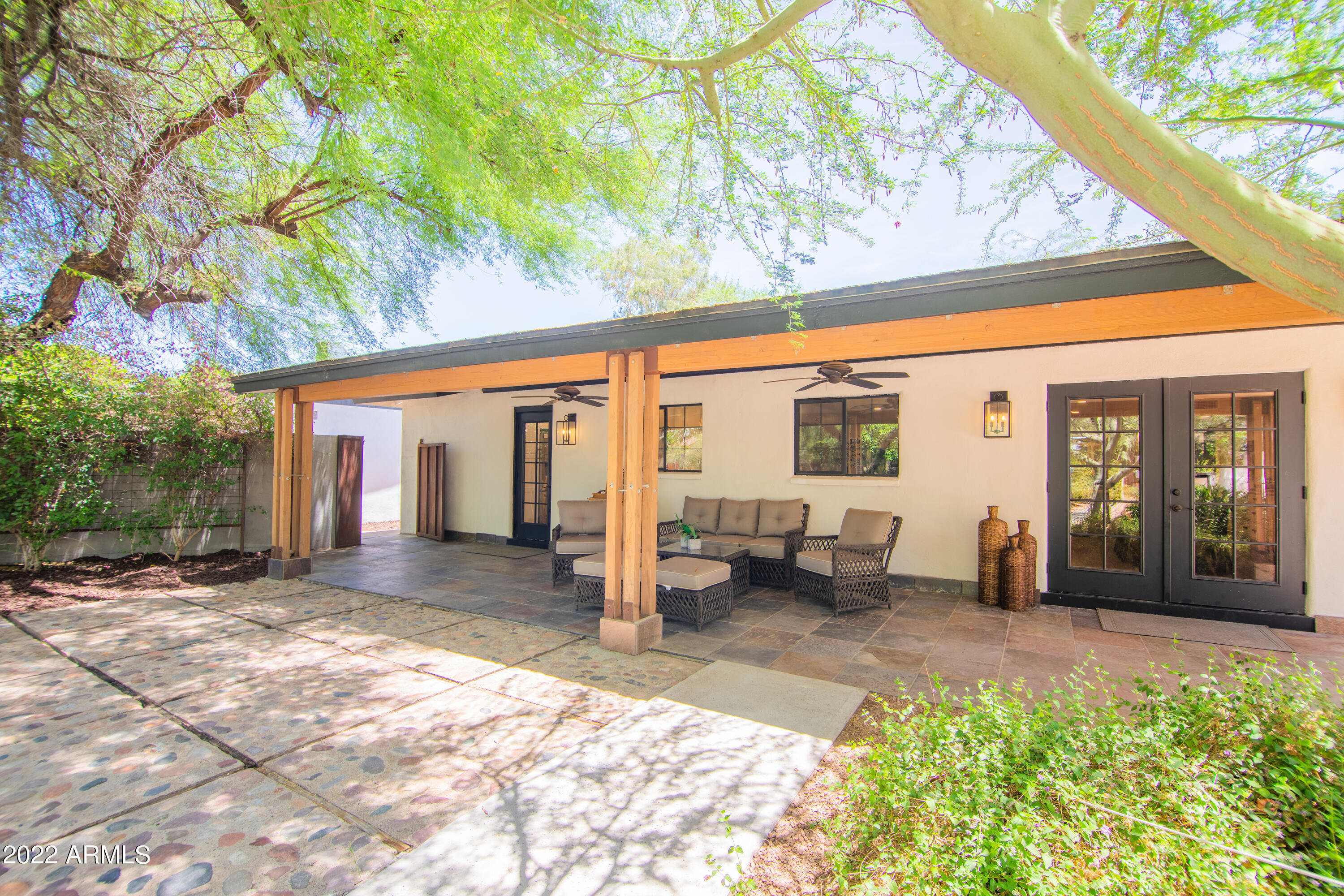 11044 North 36th Street Phoenix, AZ 85028 - Photo 40 of 49 a view of a house with backyard porch and sitting area
