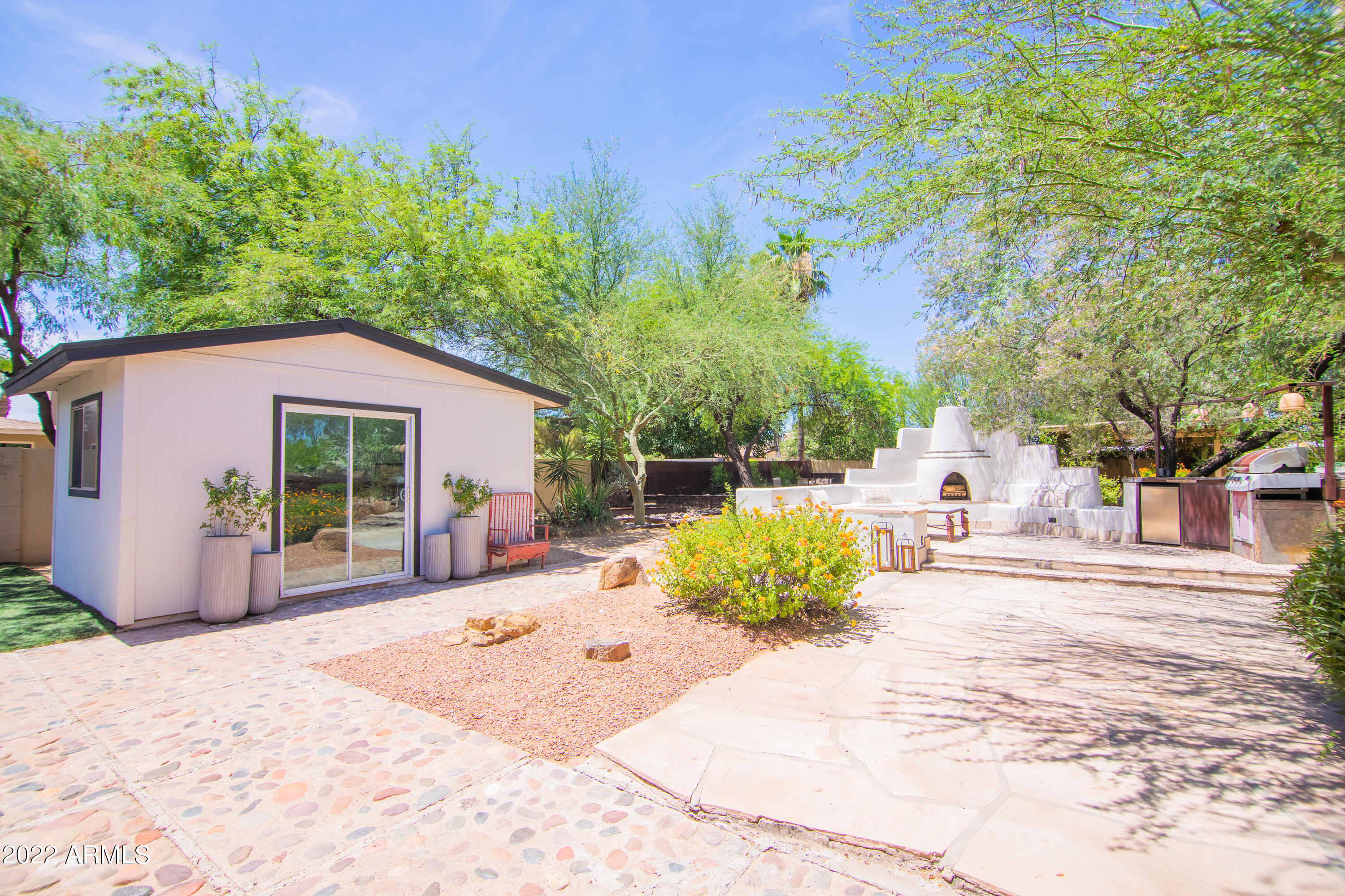 11044 North 36th Street Phoenix, AZ 85028 - Photo 42 of 49 a view of a house with a yard and sitting area