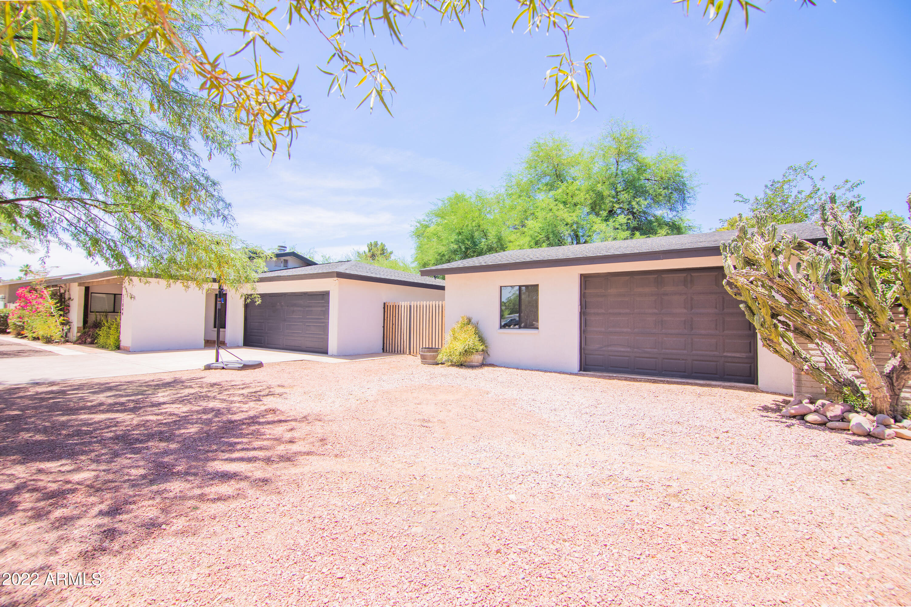 11044 North 36th Street Phoenix, AZ 85028 - Photo 8 of 49 a front view of a house with a yard and garage