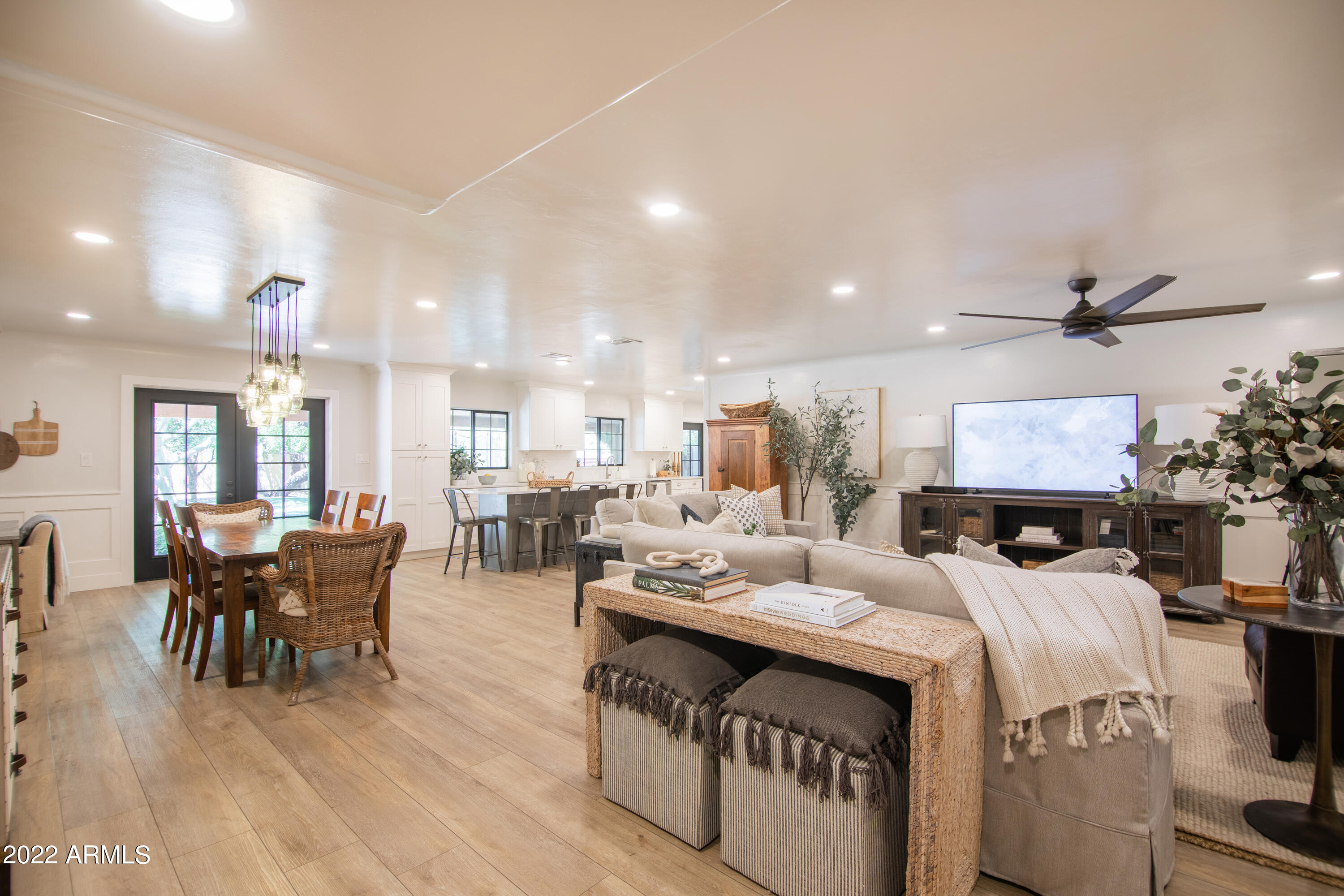 11044 North 36th Street Phoenix, AZ 85028 - Photo 9 of 49 a living room with furniture a ceiling fan and a rug