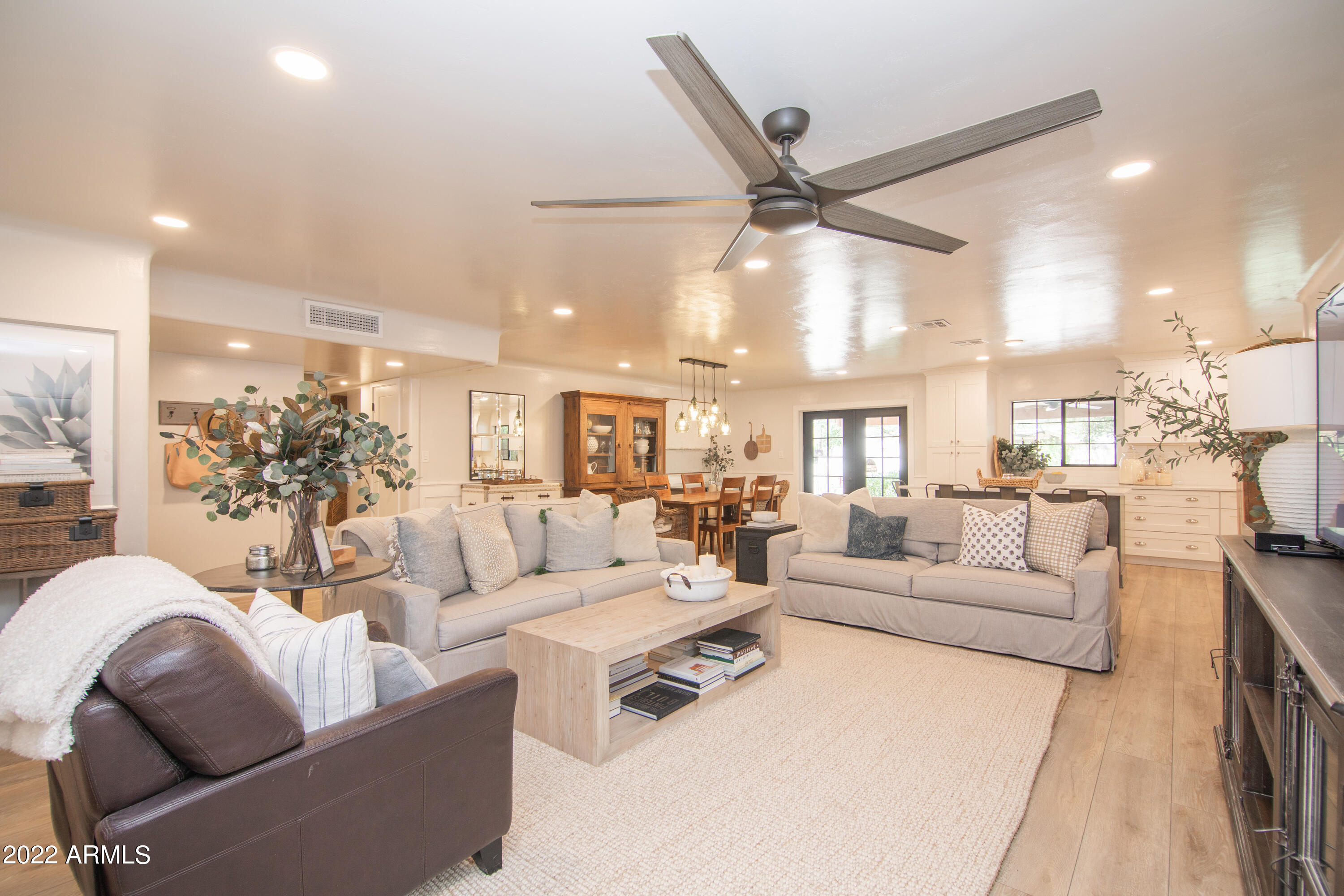 11044 North 36th Street Phoenix, AZ 85028 - Photo 10 of 49 a living room with furniture and a view of kitchen