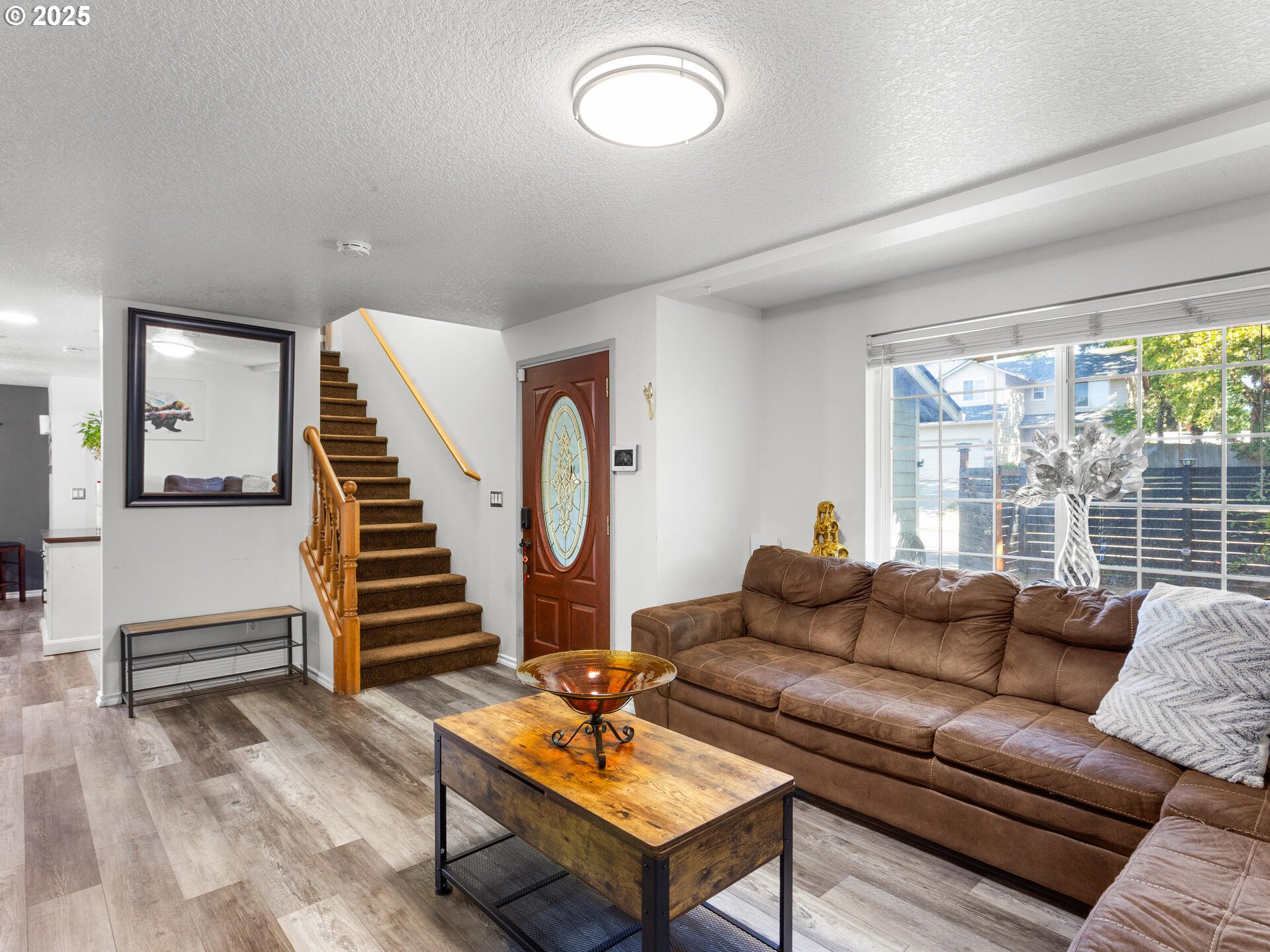 8292 Northeast Snowberry Loop Vancouver, WA 98664 - Photo 12 of 48 a living room with furniture and a large window