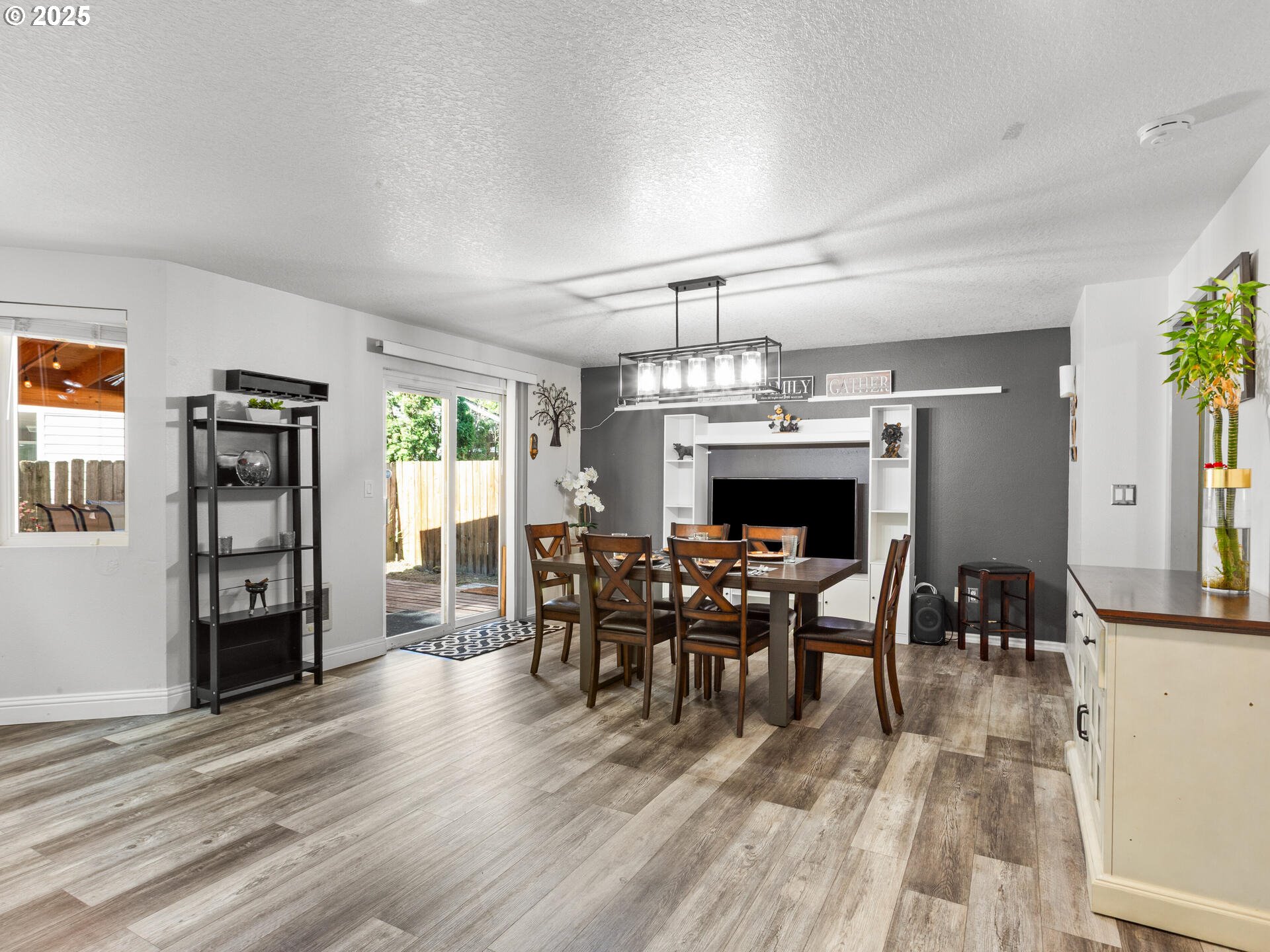8292 Northeast Snowberry Loop Vancouver, WA 98664 - Photo 14 of 48 a view of a dining room with furniture and chandelier