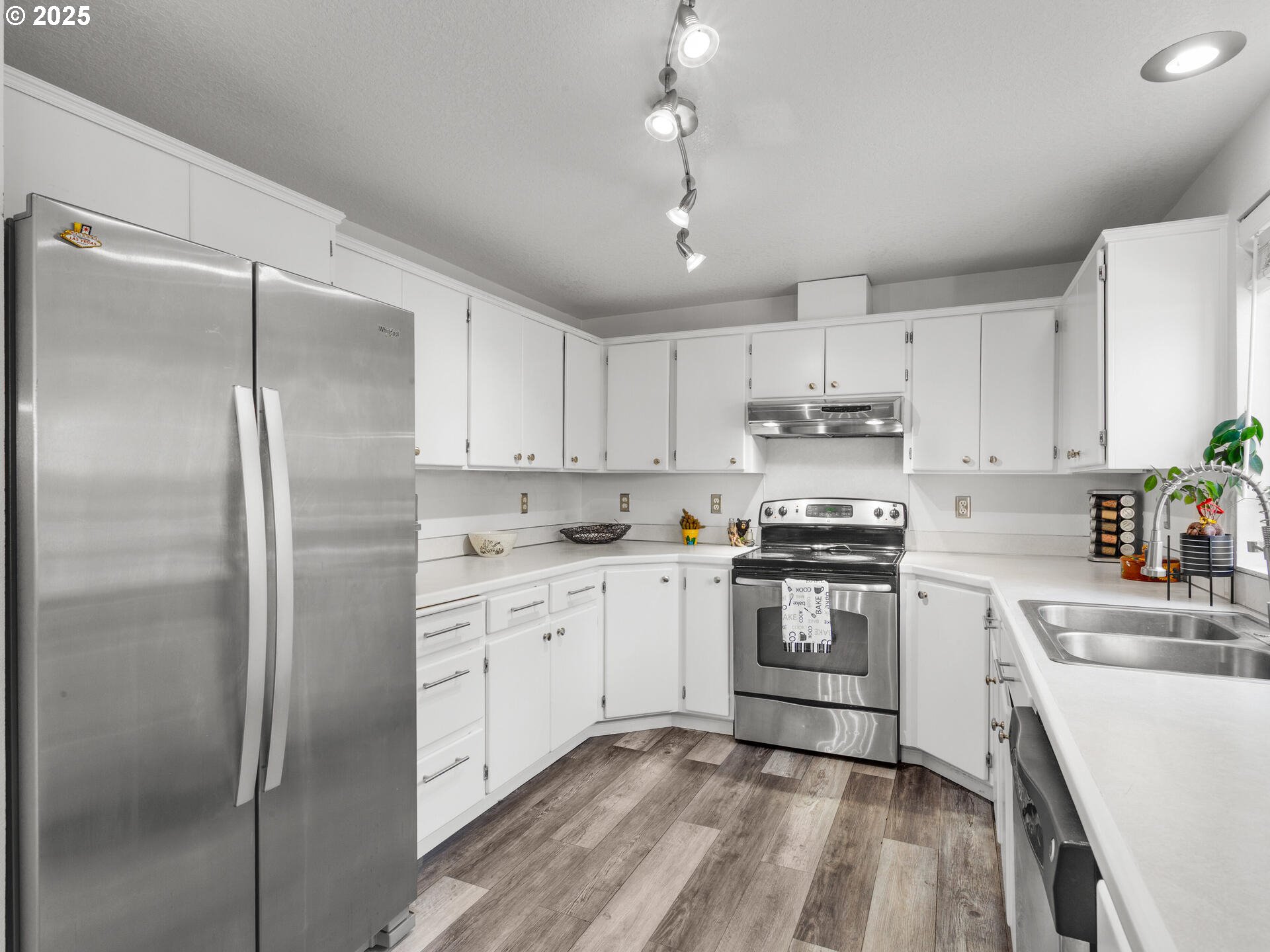 8292 Northeast Snowberry Loop Vancouver, WA 98664 - Photo 22 of 48 a kitchen with cabinets stainless steel appliances and a counter space