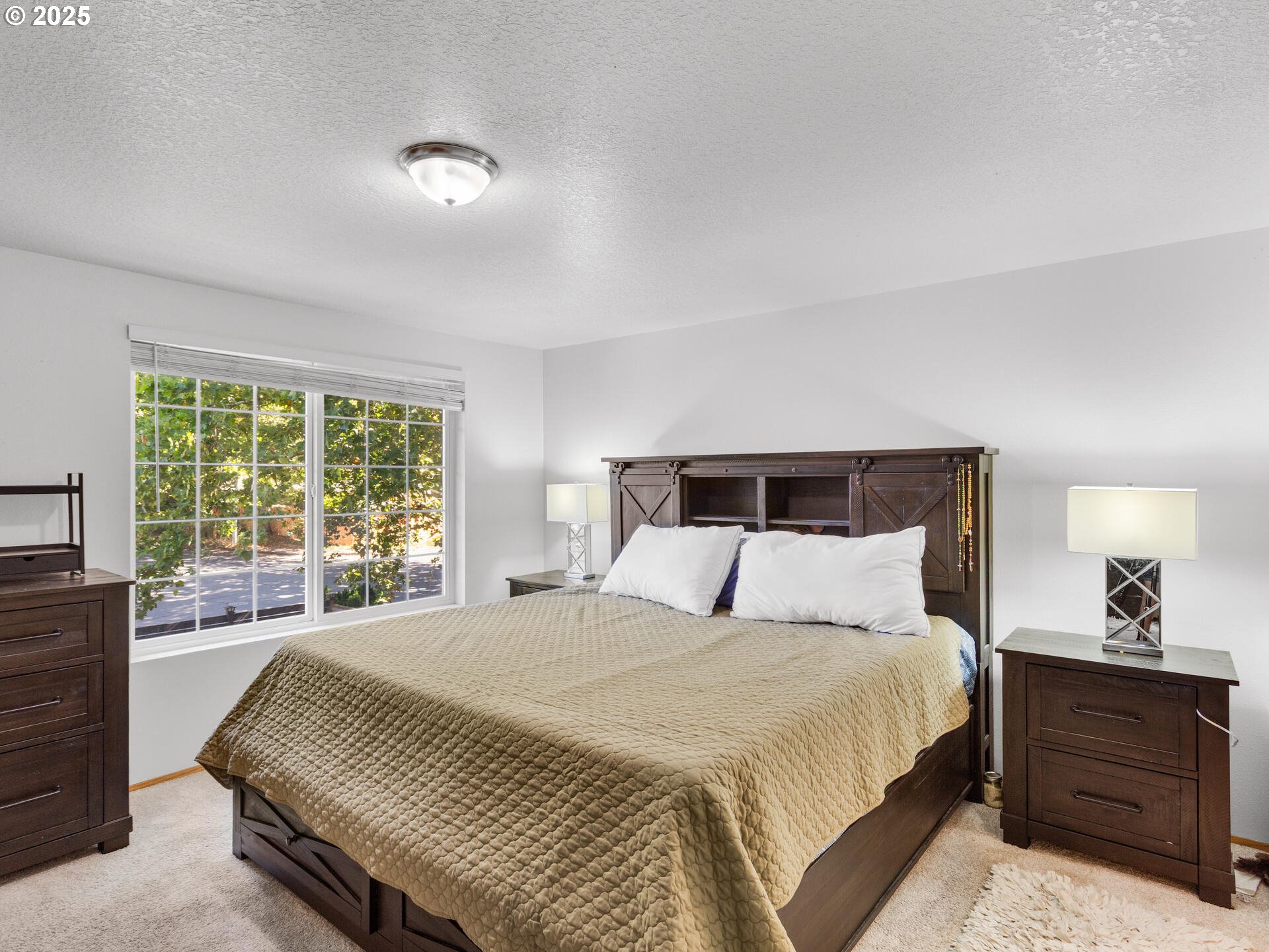 8292 Northeast Snowberry Loop Vancouver, WA 98664 - Photo 29 of 48 a bedroom with a bed and a window