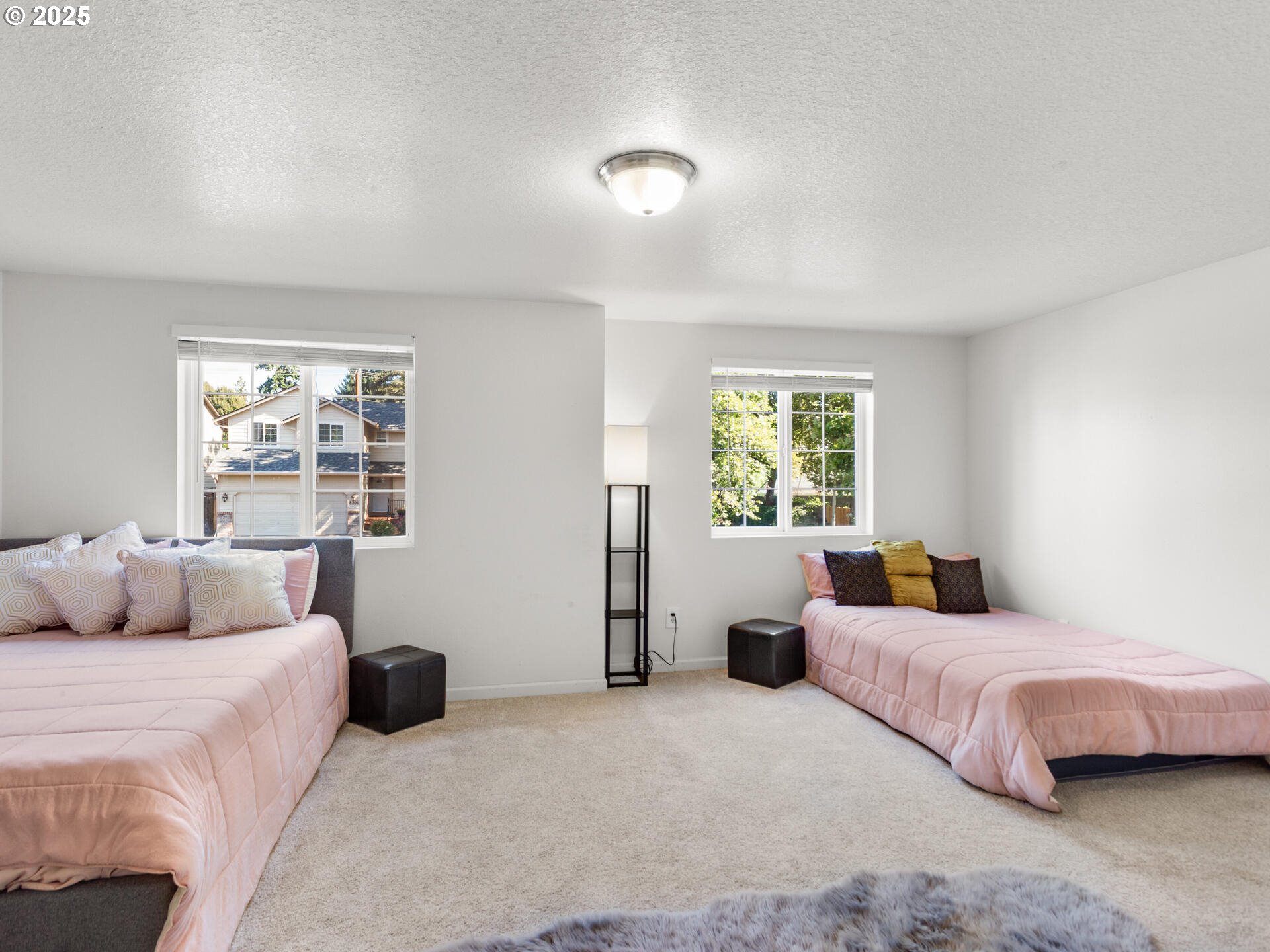 8292 Northeast Snowberry Loop Vancouver, WA 98664 - Photo 33 of 48 a bedroom with a bed and a window